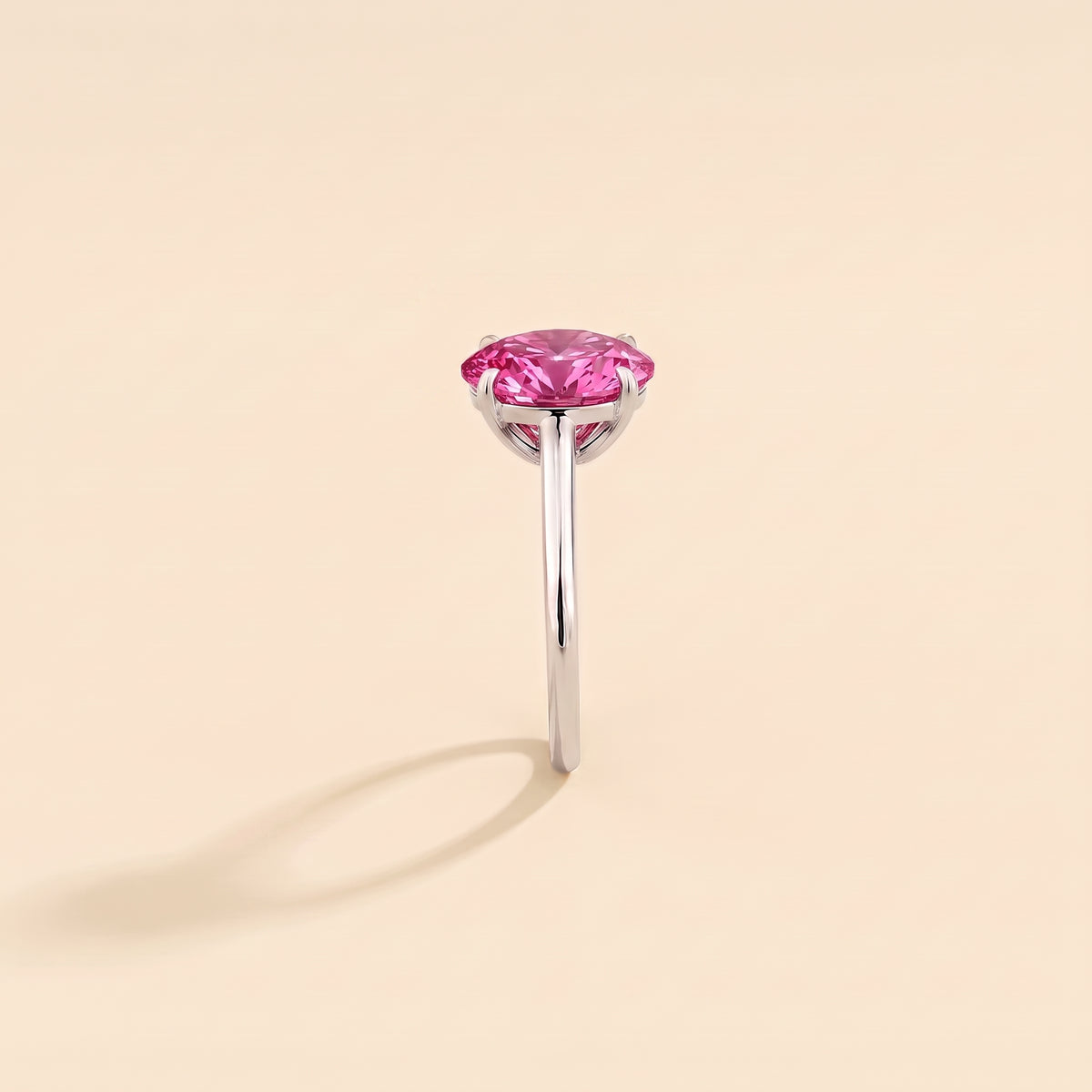 Lyra Oval Shape Vivid Pink Sapphire Cathedral Solitaire Ring side edge