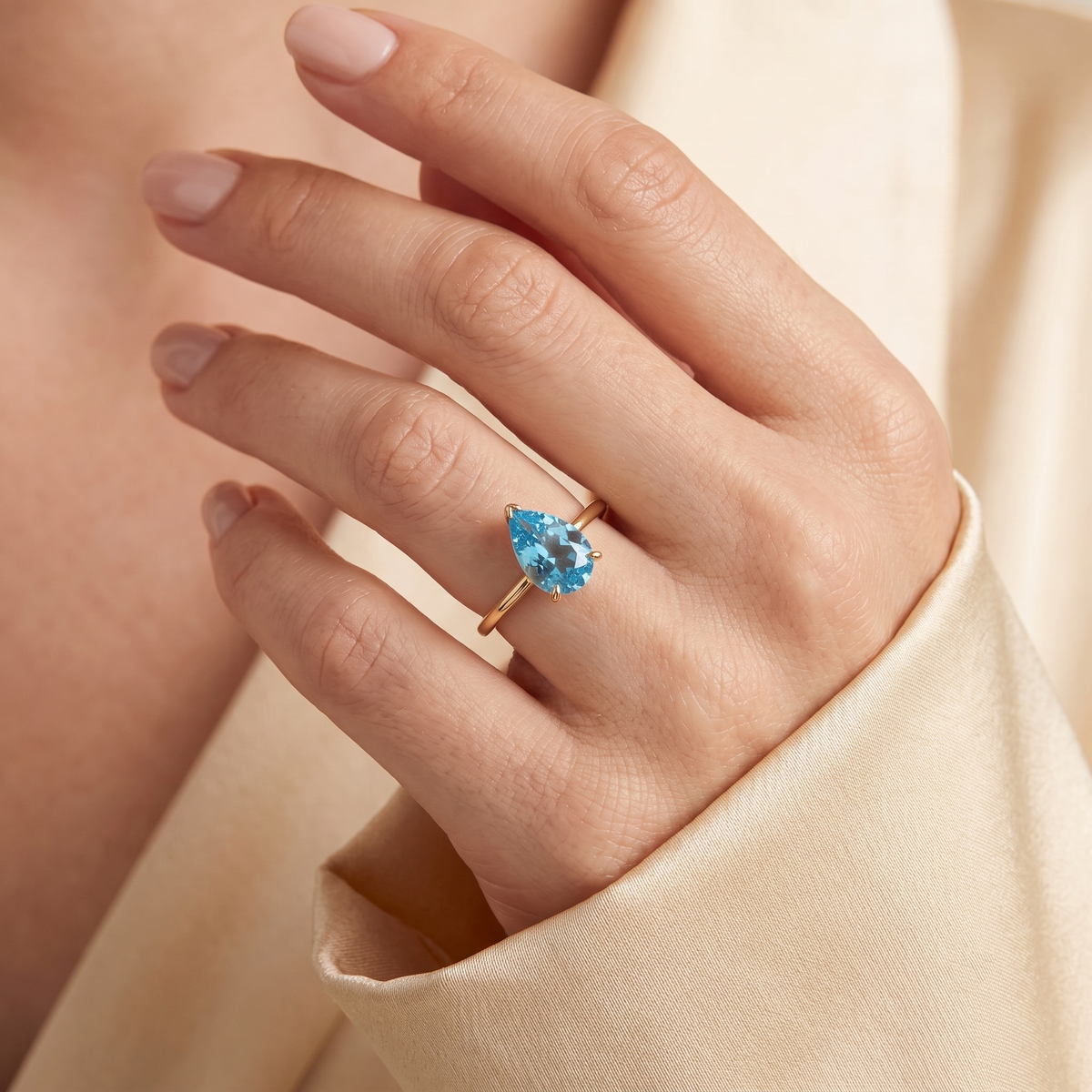 A model is wearing Pandal Pear Shape Aquamarine Cathedral Solitaire Ring