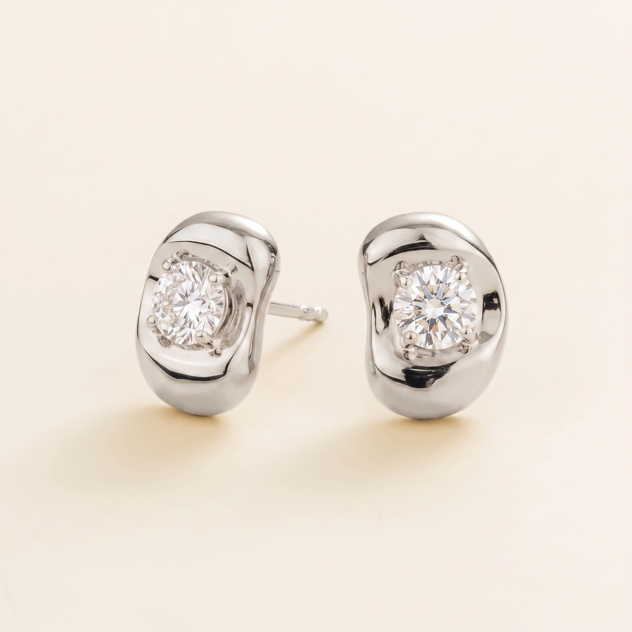 Fava Oval Diamond Stud Earrings in White Gold – angle view