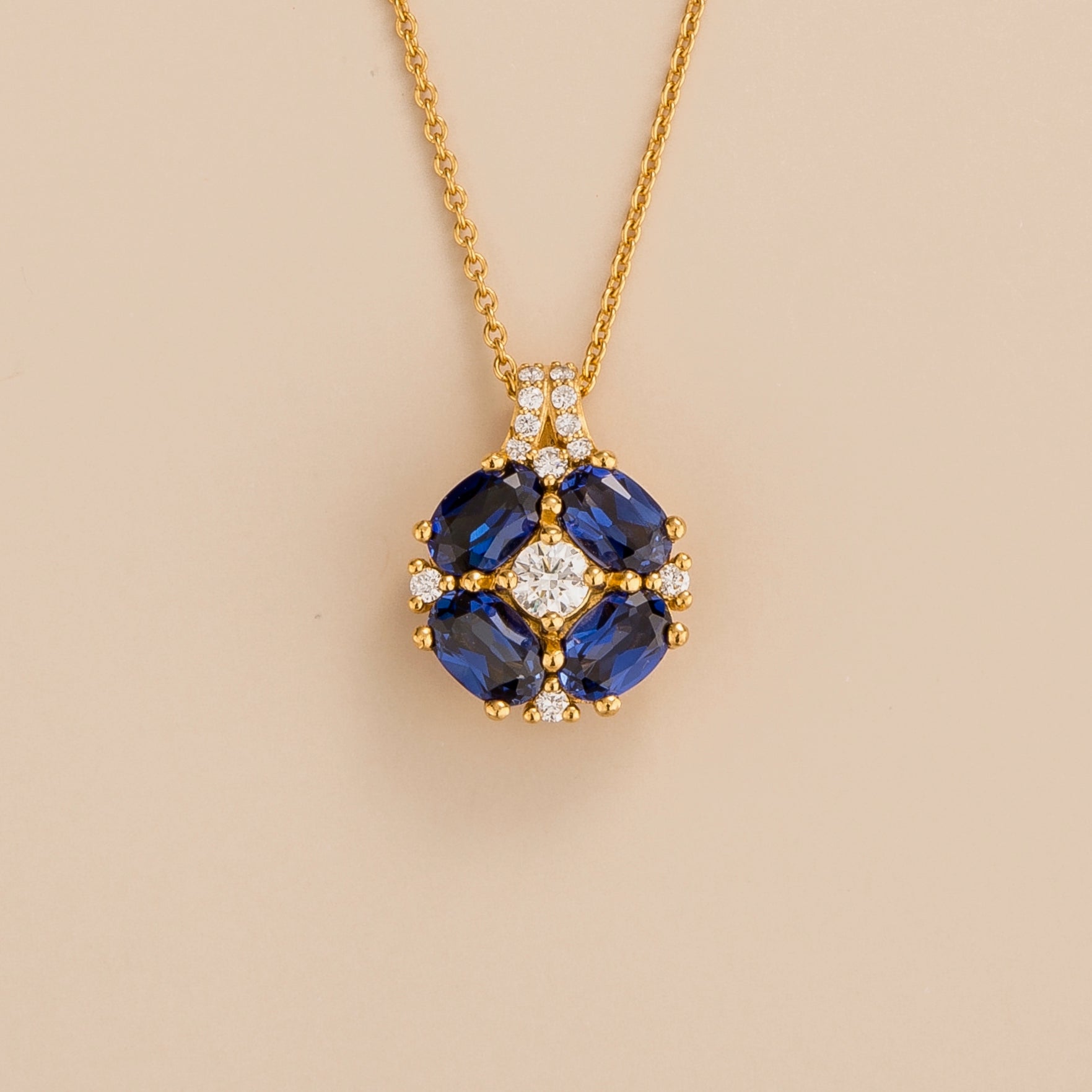 Pristi pendant necklace in 18K gold vermeil set with lab grown Diamonds and Blue sapphire gem stones. Perfect for yourself and as gift.
