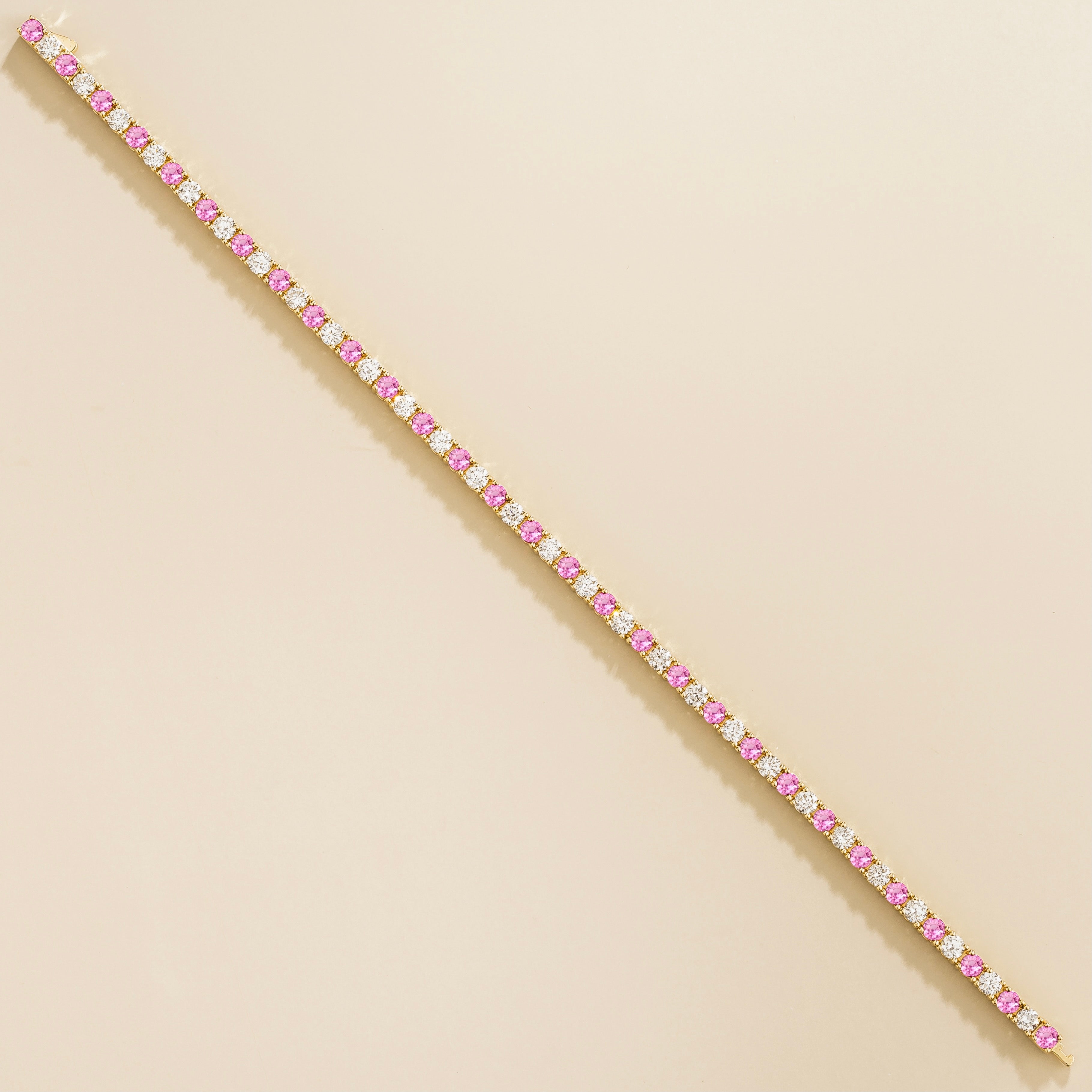 adjustable gold tennis bracelet with pink sapphire and lab grown diamonds