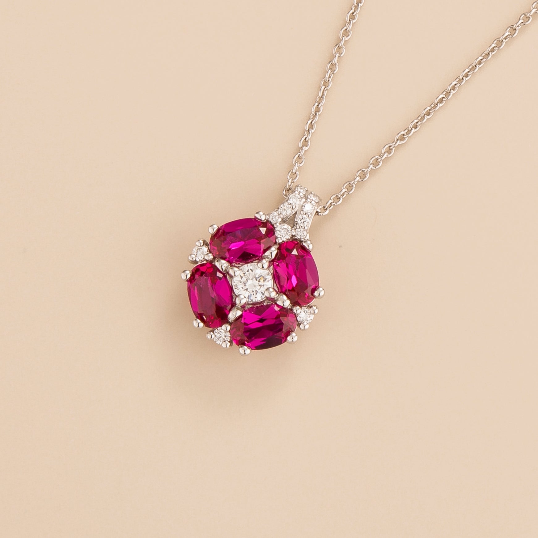 Pristi pendant necklace in 18K white gold vermeil set with lab grown Diamond and oval cut Ruby gem stones.