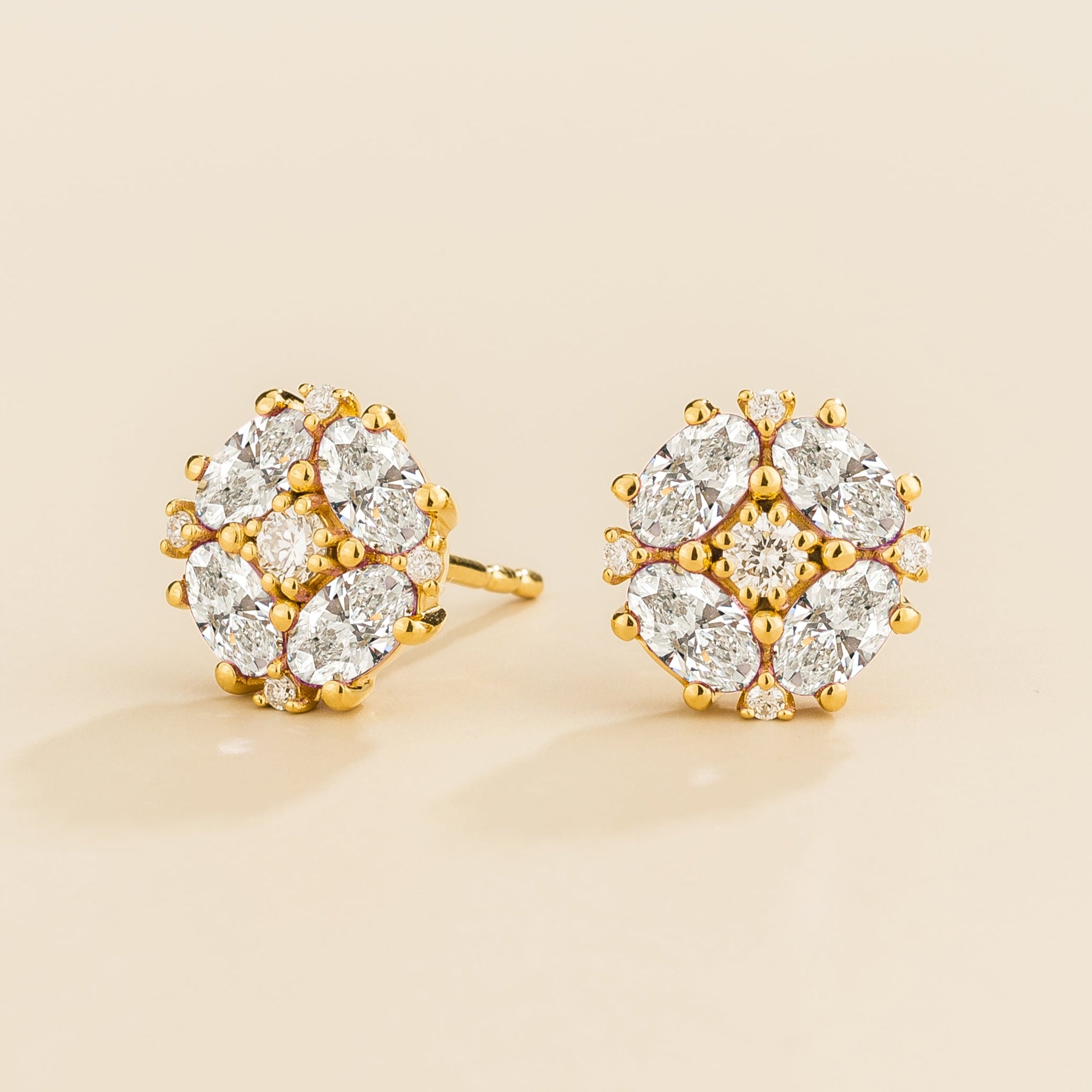 Gold earrings from Juvetti set with diamonds.