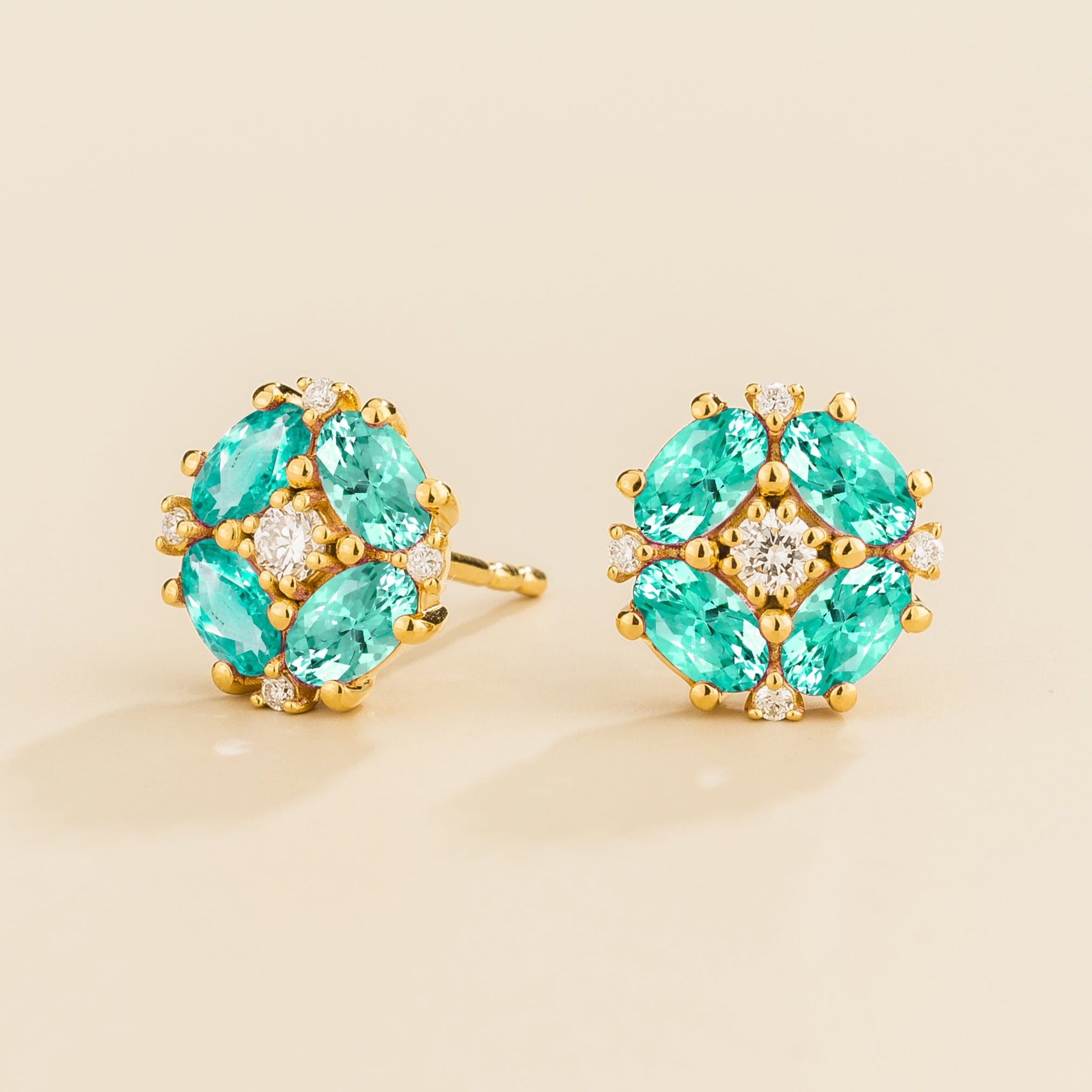 Gold earrings set with paraiba sapphire and diamonds from Juvetti.