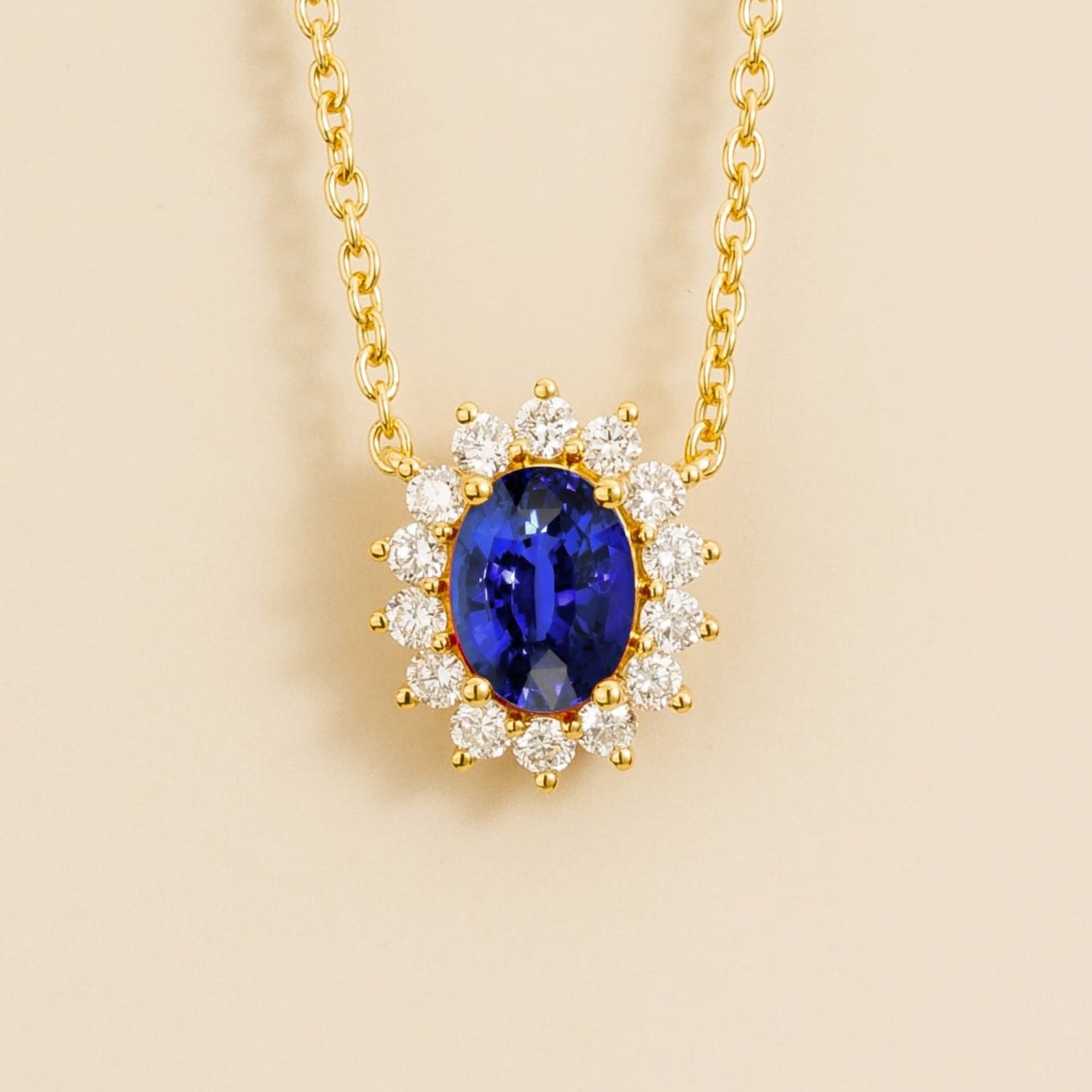 Gold necklace from Juvetti called divo set in blue sapphire and diamonds.