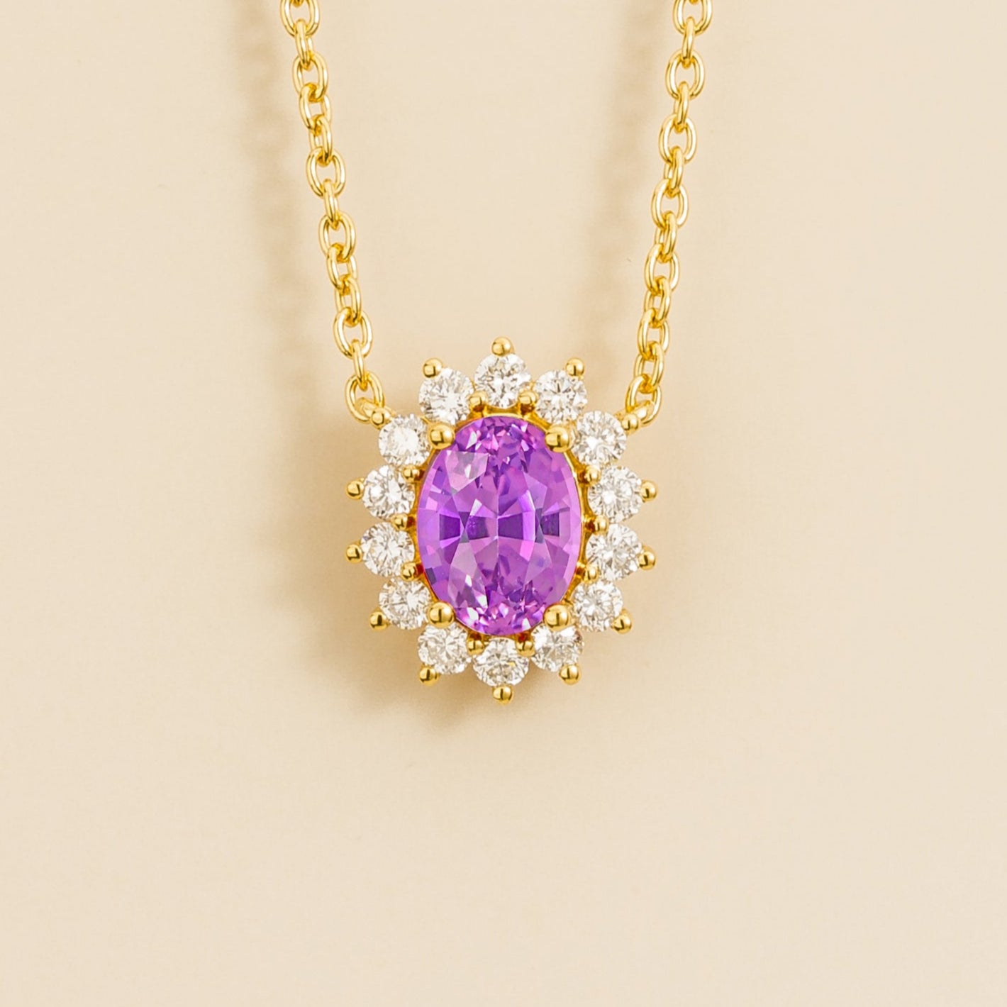 Gold necklace from Juvetti called divo set in purple sapphire and diamonds.
