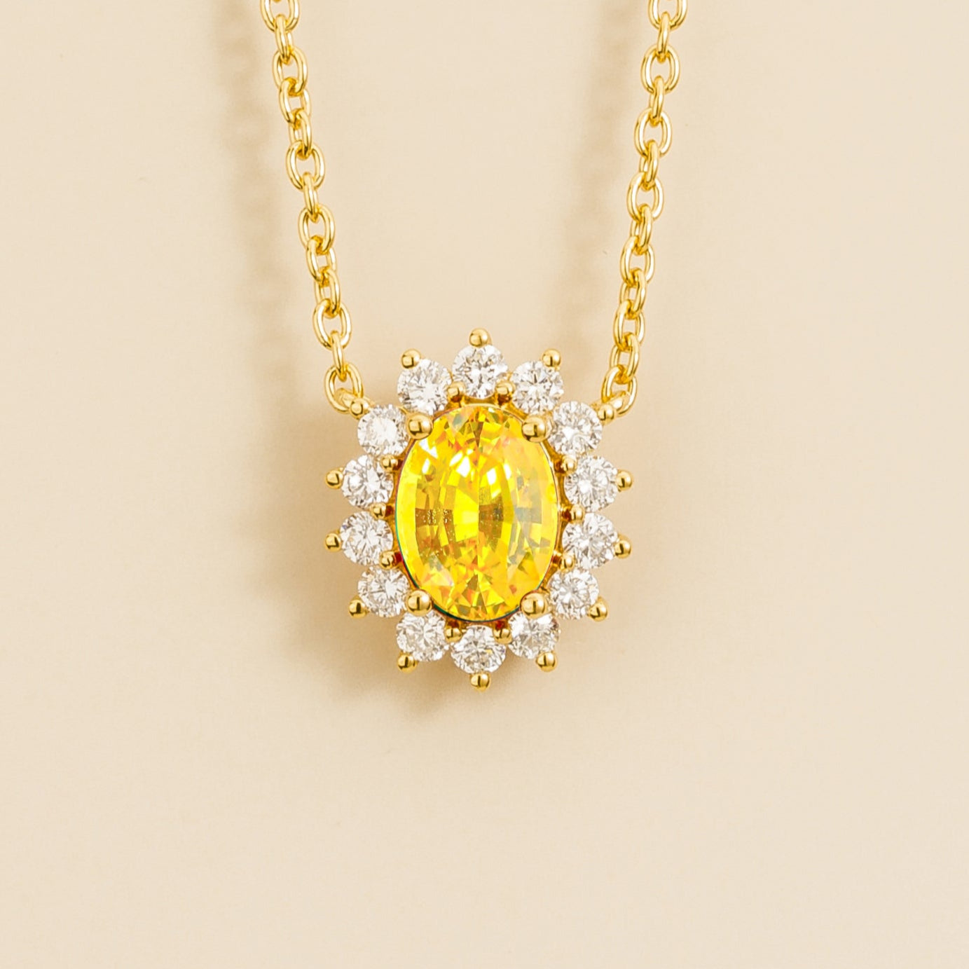 Divo gold necklace from Juvetti set in yellow sapphire and diamonds.