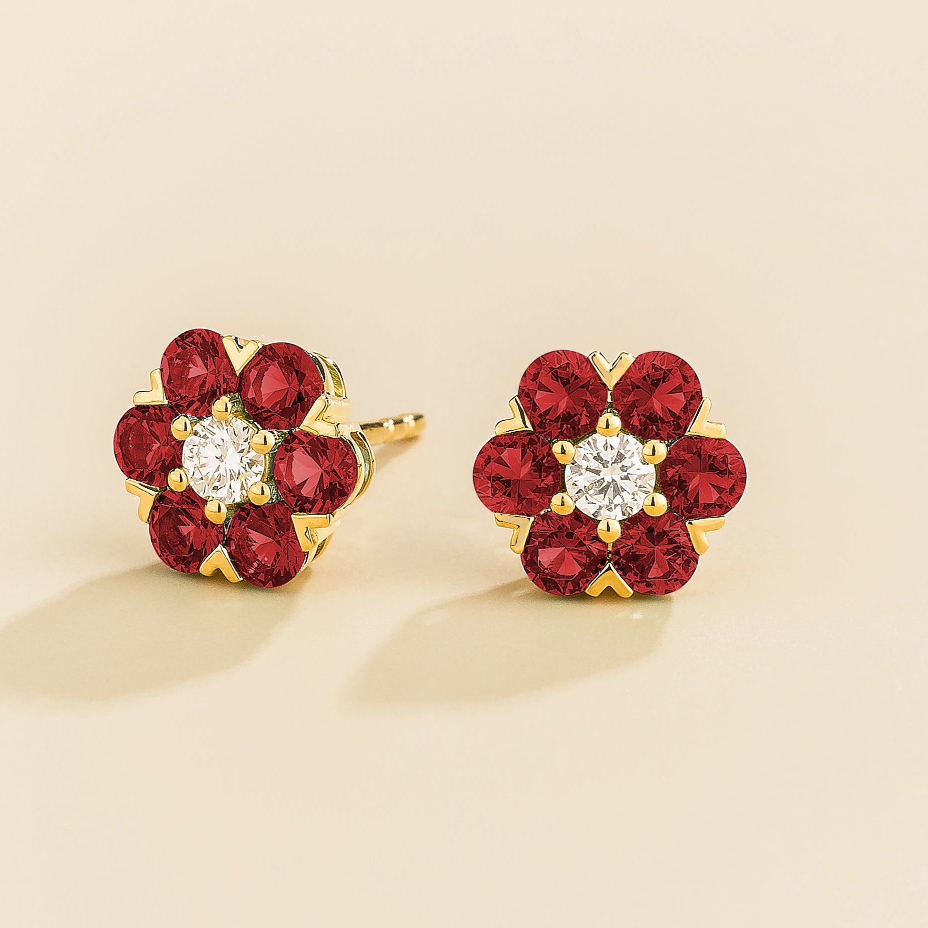 Cinq earrings in gold set with Diamonds and Ruby.