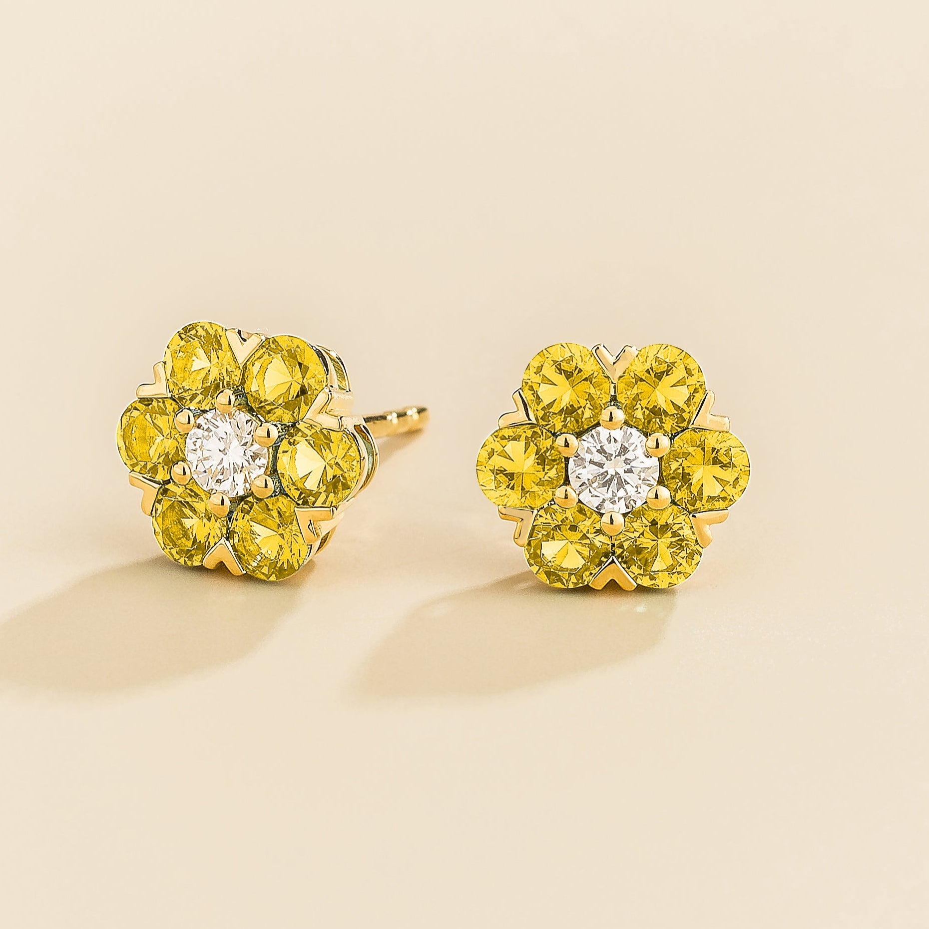 Cinq earrings in gold set with Diamonds and Yellow Sapphires.