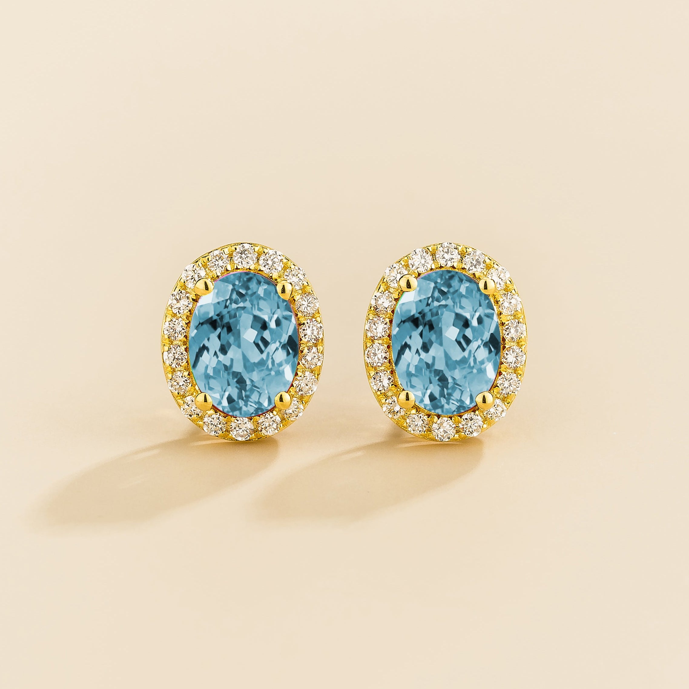 Mina earrings in Aquamarine and diamonds set in gold.