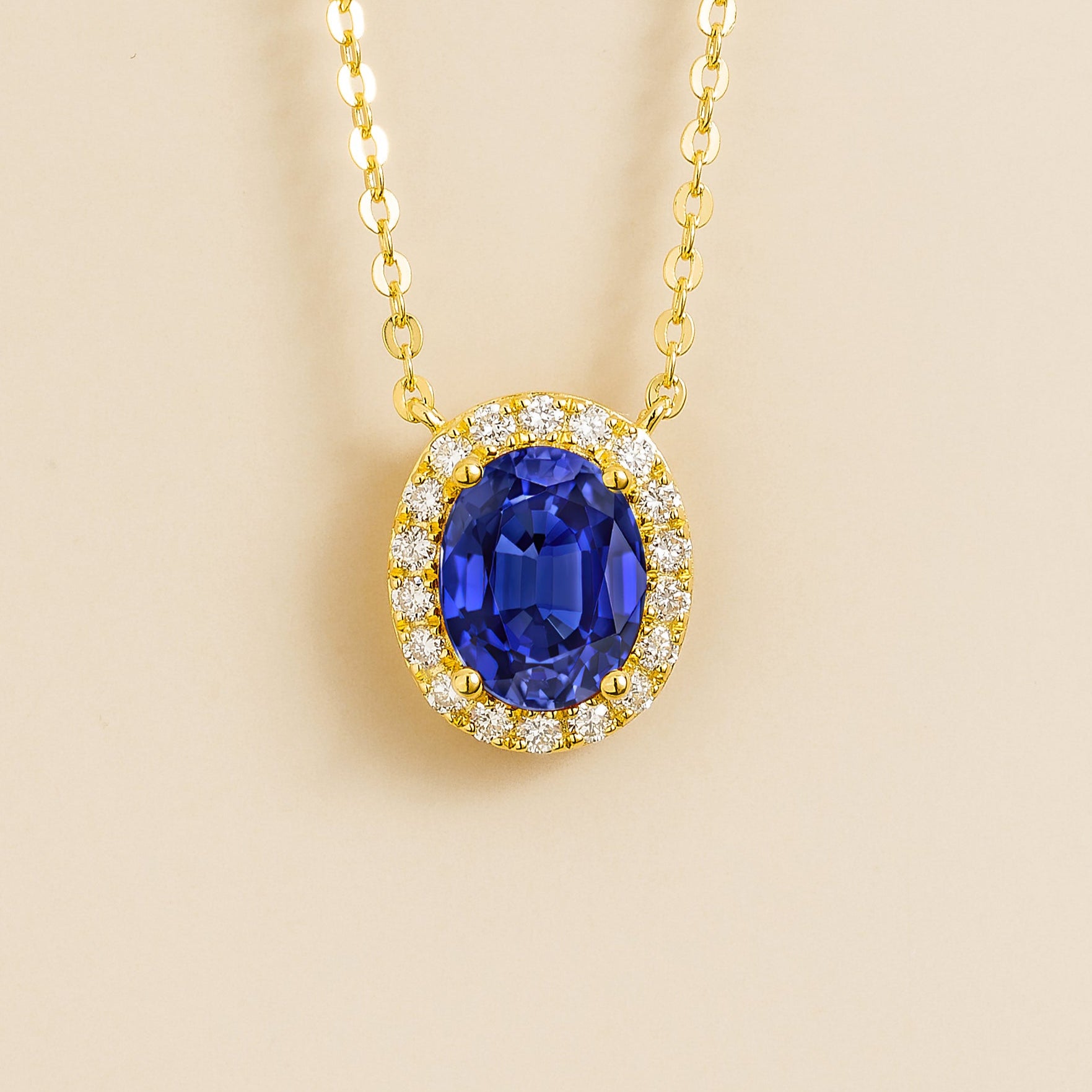 Mina Gold Necklace Set With Oval Shape Blue Sapphire & Round Diamond Halo