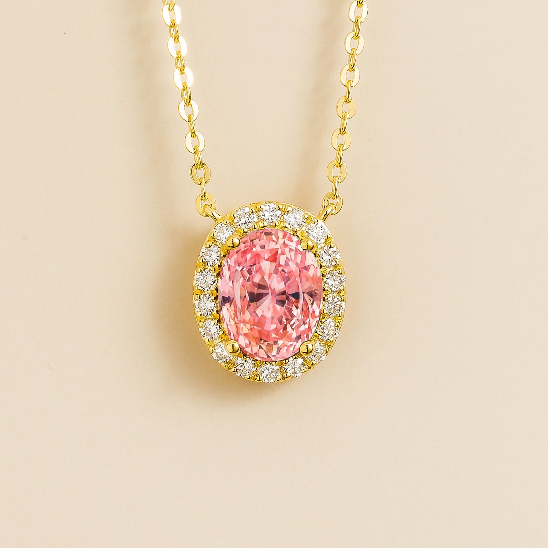 An image of Padparadscha necklace with diamonds set in gold chain from Juvetti.