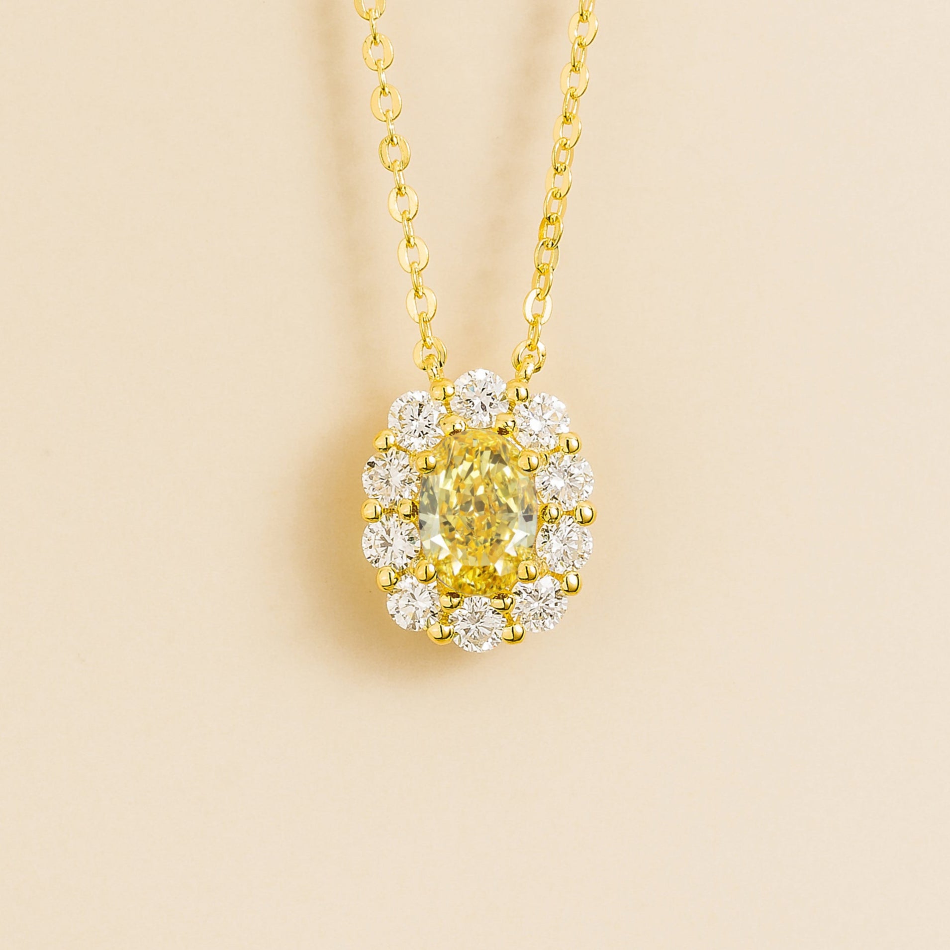 Prill Necklace in Gold set with oval Yellow Sapphire and Round Halo Diamonds. London jewellery store