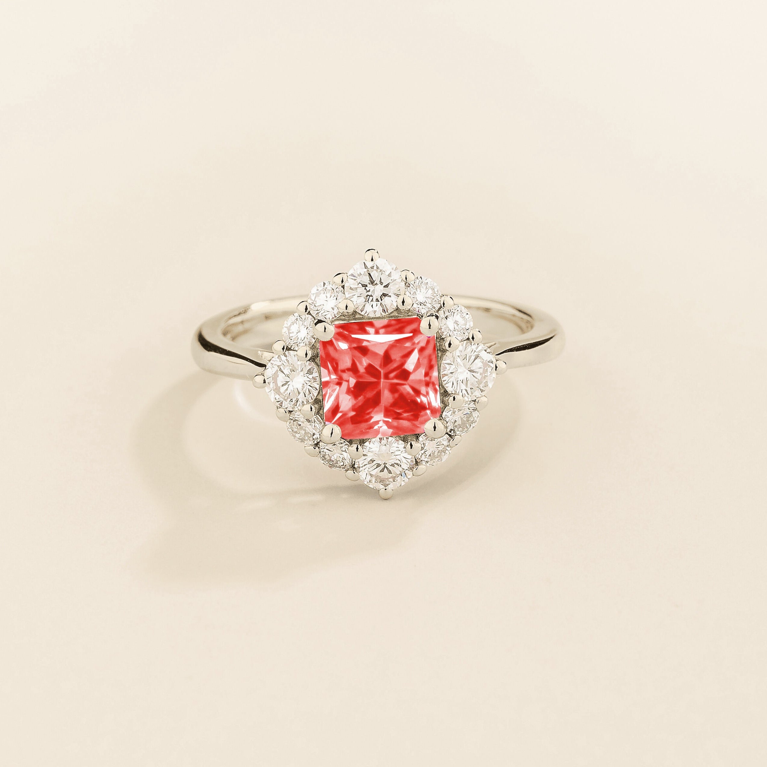 Juvetti white gold ring featuring an octagon-cut lab-grown padparadscha sapphire surrounded by round brilliant lab-grown diamonds in a halo design.