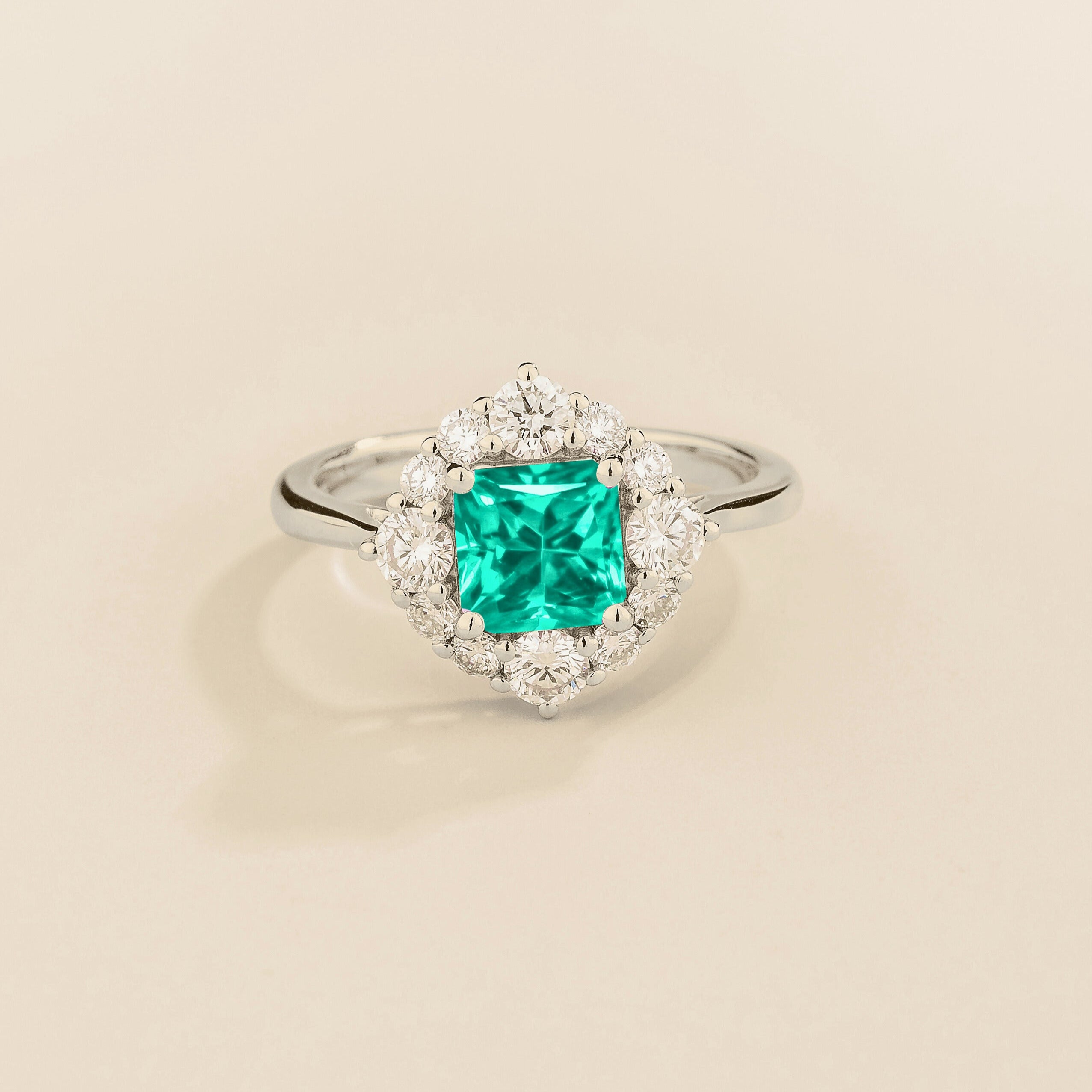 Juvetti white gold ring featuring an octagon-cut lab-grown paraiba gemstone surrounded by round brilliant lab-grown diamonds in a halo design.