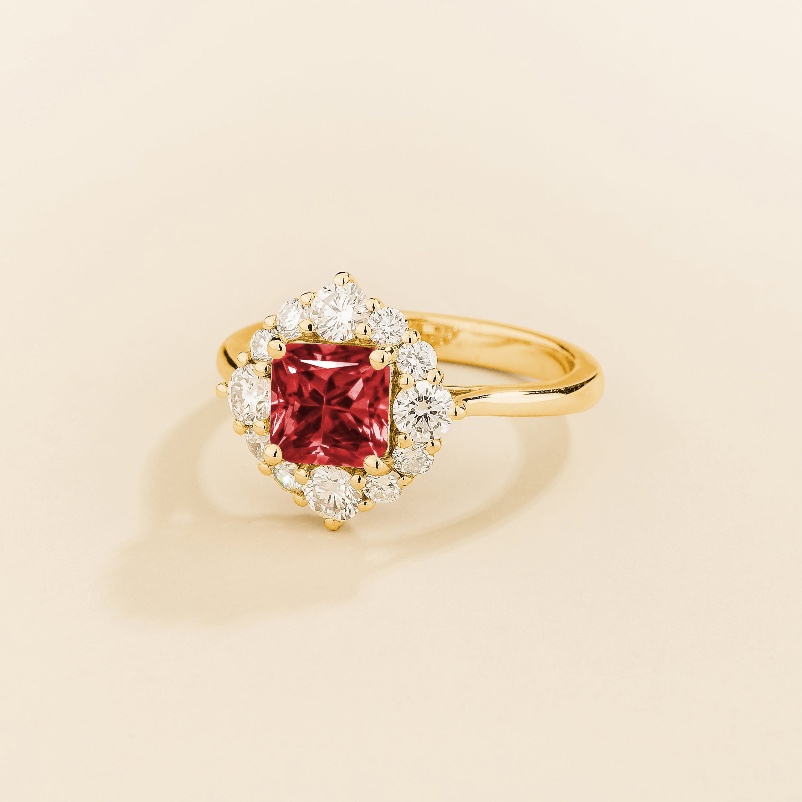 Tuli halo ring in gold set with Ruby and Diamonds.