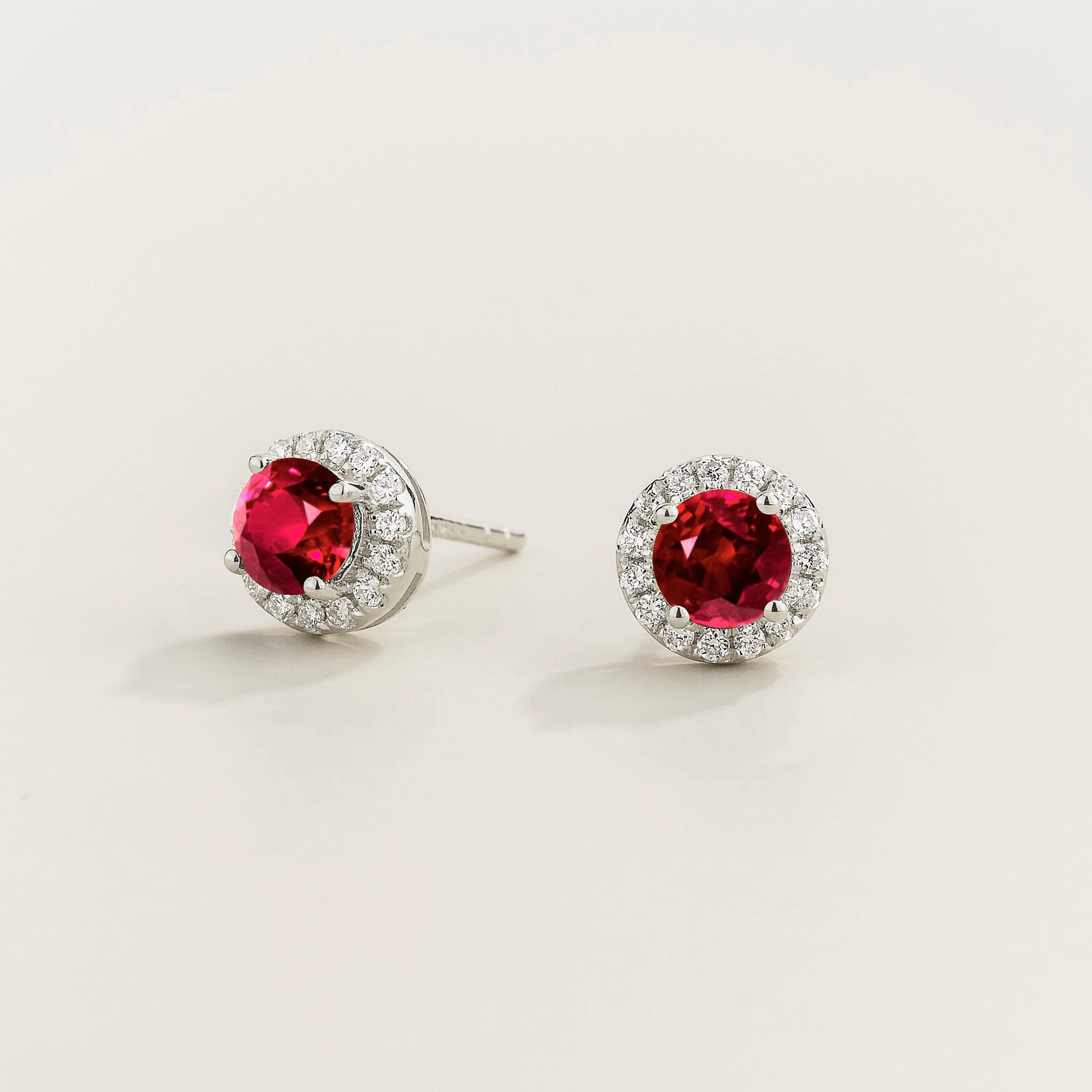 Mars Ruby Round & Diamond Halo Earrings In White Gold