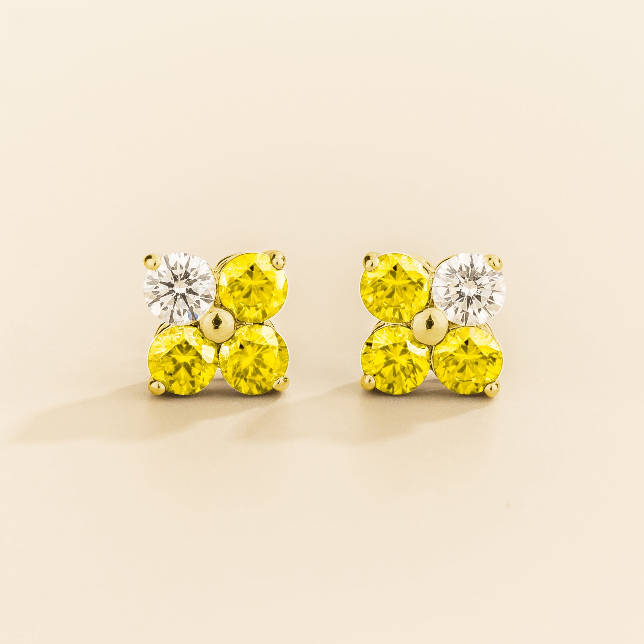 Pair of 4 gemstones yellow sapphire and diamond earrings in gold
