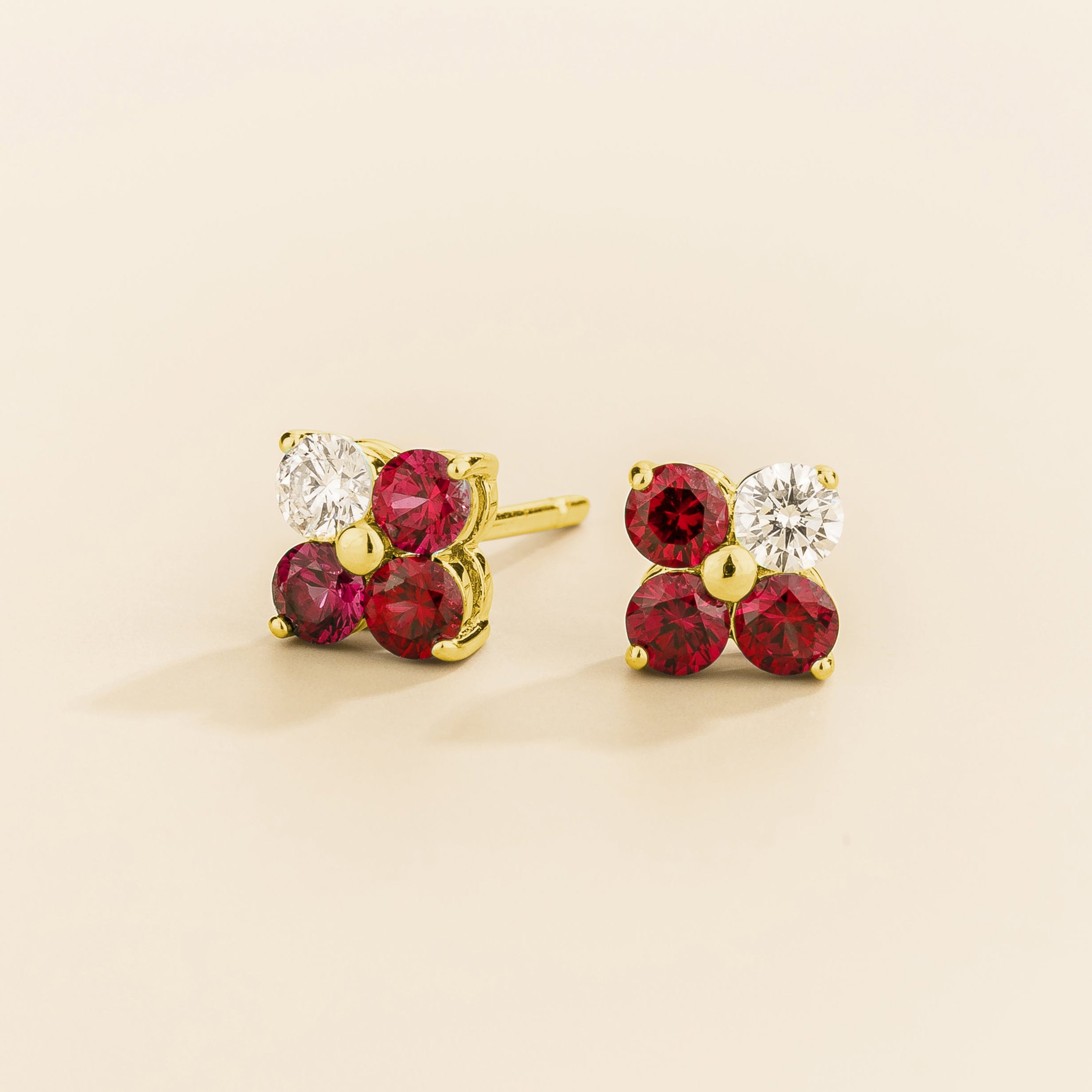 Petale 4-gemstones stud earrings in gold set with ~0.7 carats of ruby and ~0.2 Diamonds