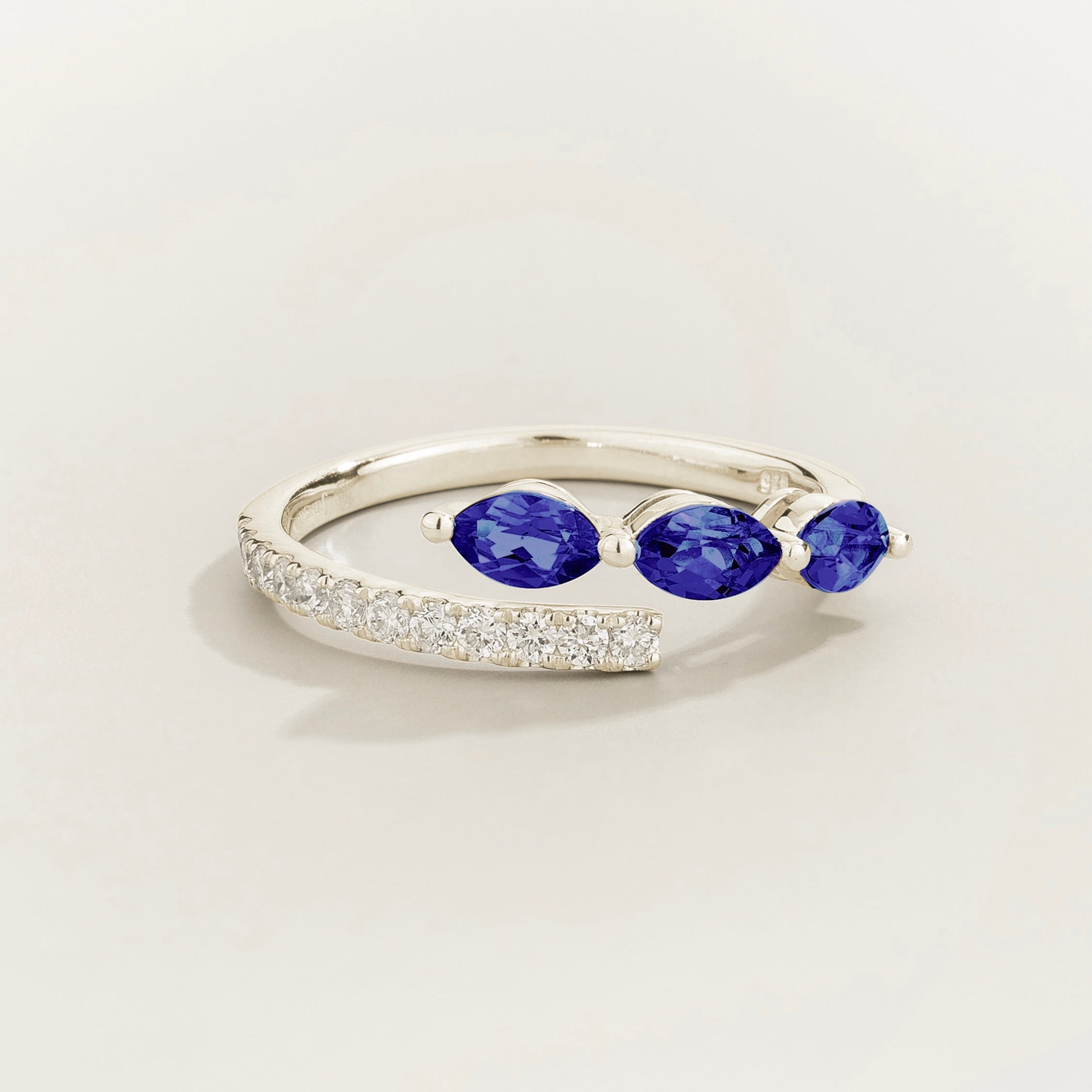 Sava ring in white gold set with dark blue Sapphire and Diamonds.