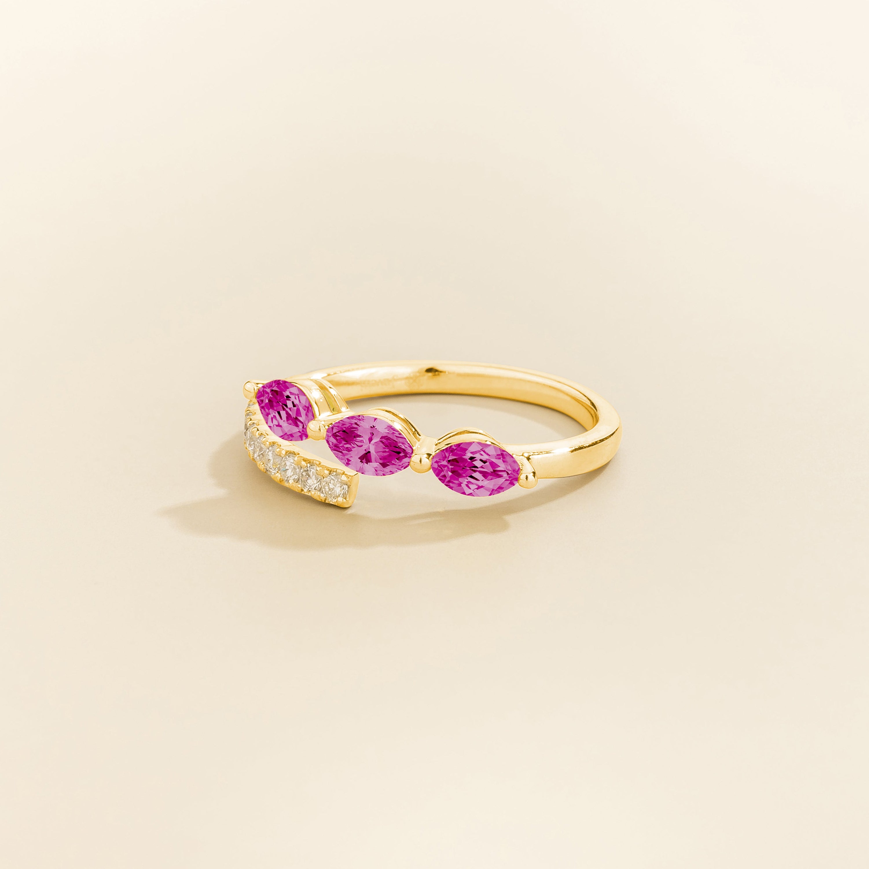 Juvetti gold open band ring featuring marquise cut lab-grown dark pink sapphires and pavé-set lab-grown diamonds.
