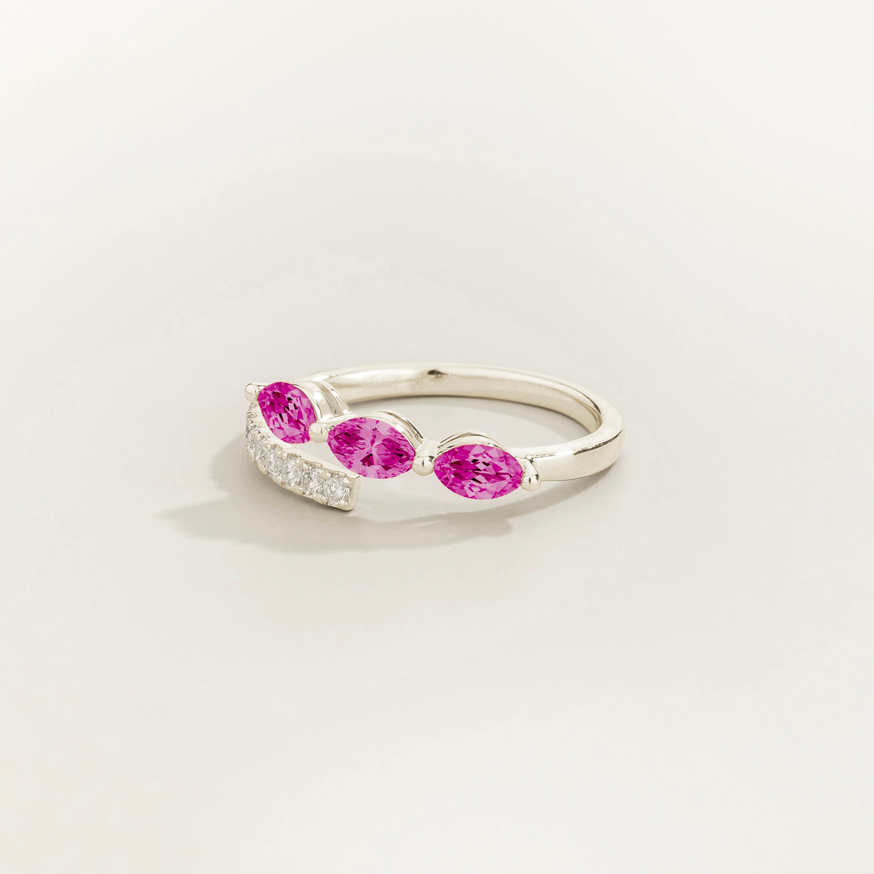 Sava ring in white gold set with dark pink Sapphire and Diamonds.