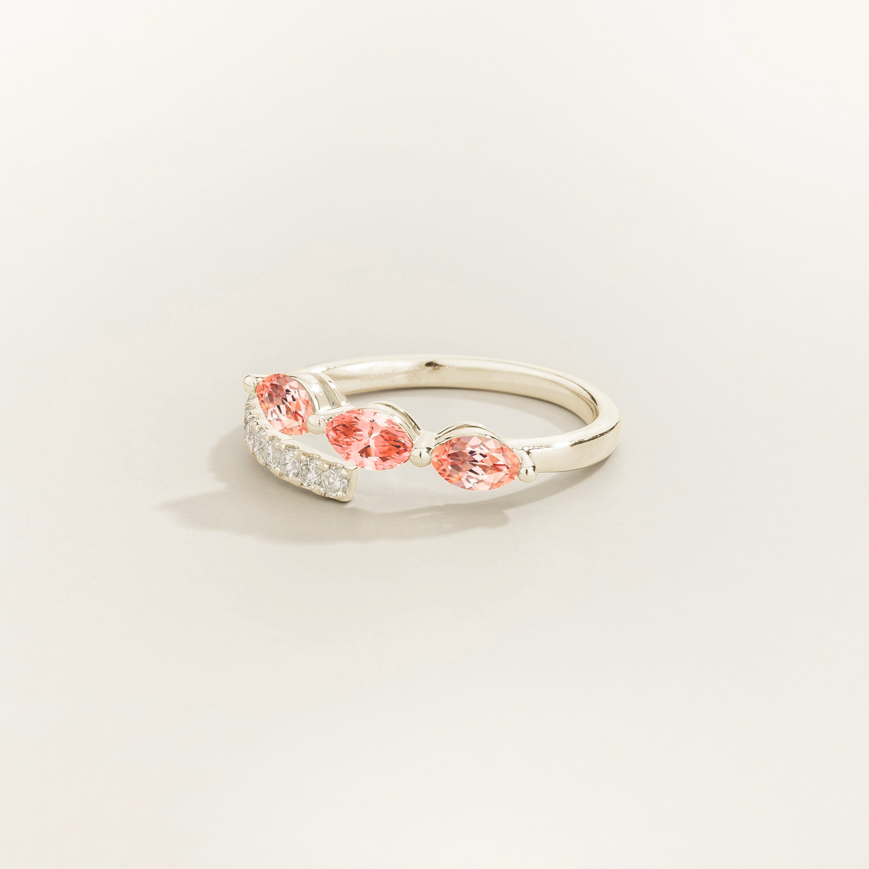 Sava ring in white gold set with Padparadscha Sapphire and Diamonds.