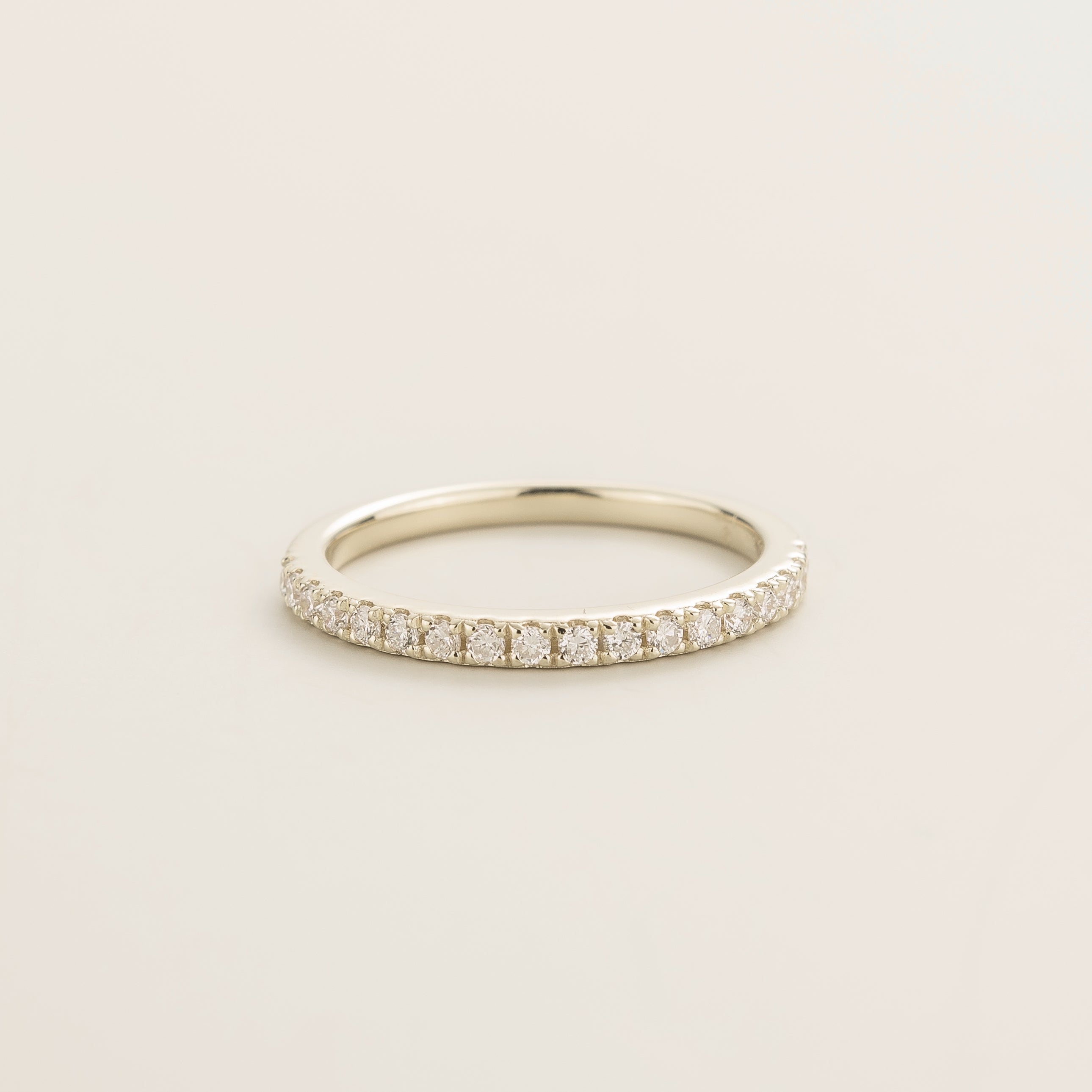 Juvetti white gold half eternity band set with round lab-grown diamonds.
