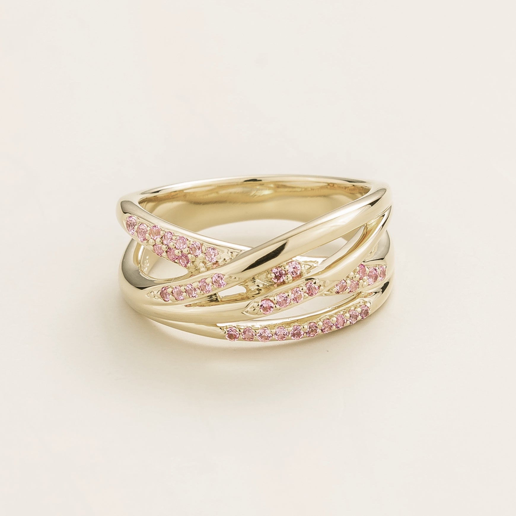 Juvetti white gold crossover ring set with round lab-grown pink sapphires.