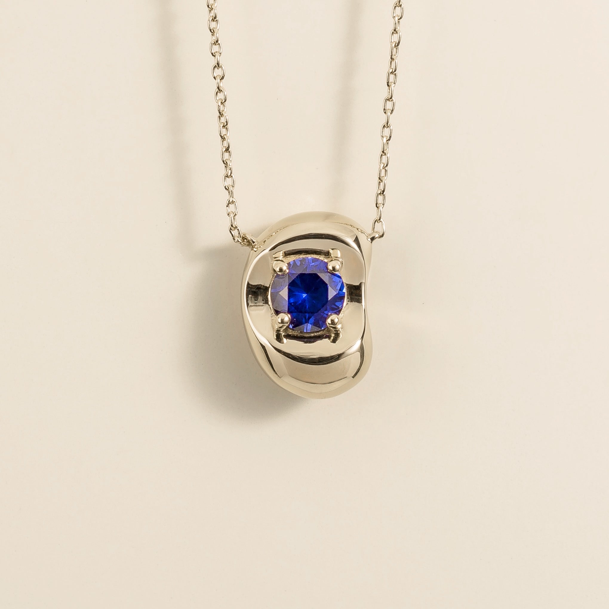Fava Round Blue Sapphire Oval Pendant Necklace in White Gold