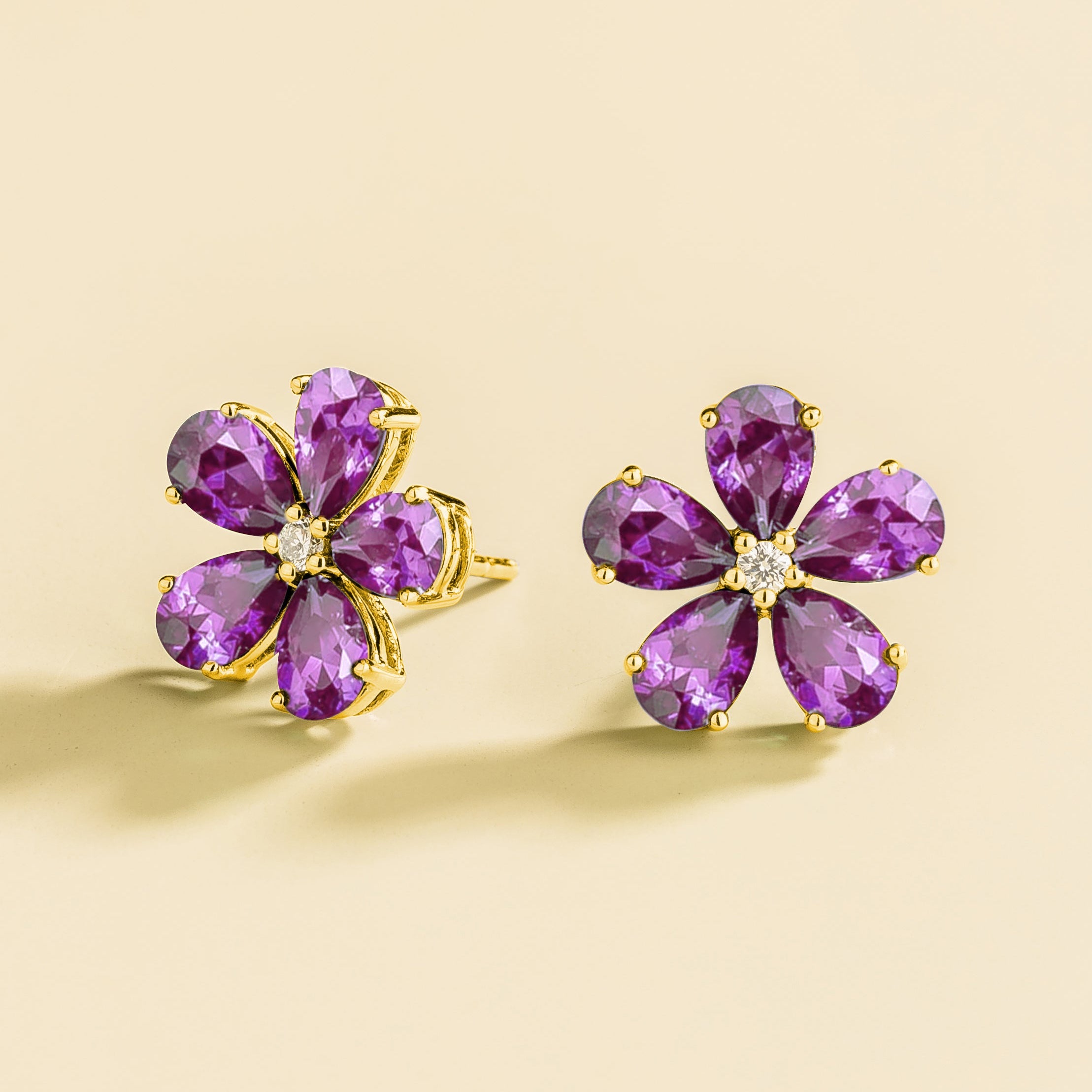 Florea 5 petals flower earrings in gold set with Purple Sapphires and Diamonds.