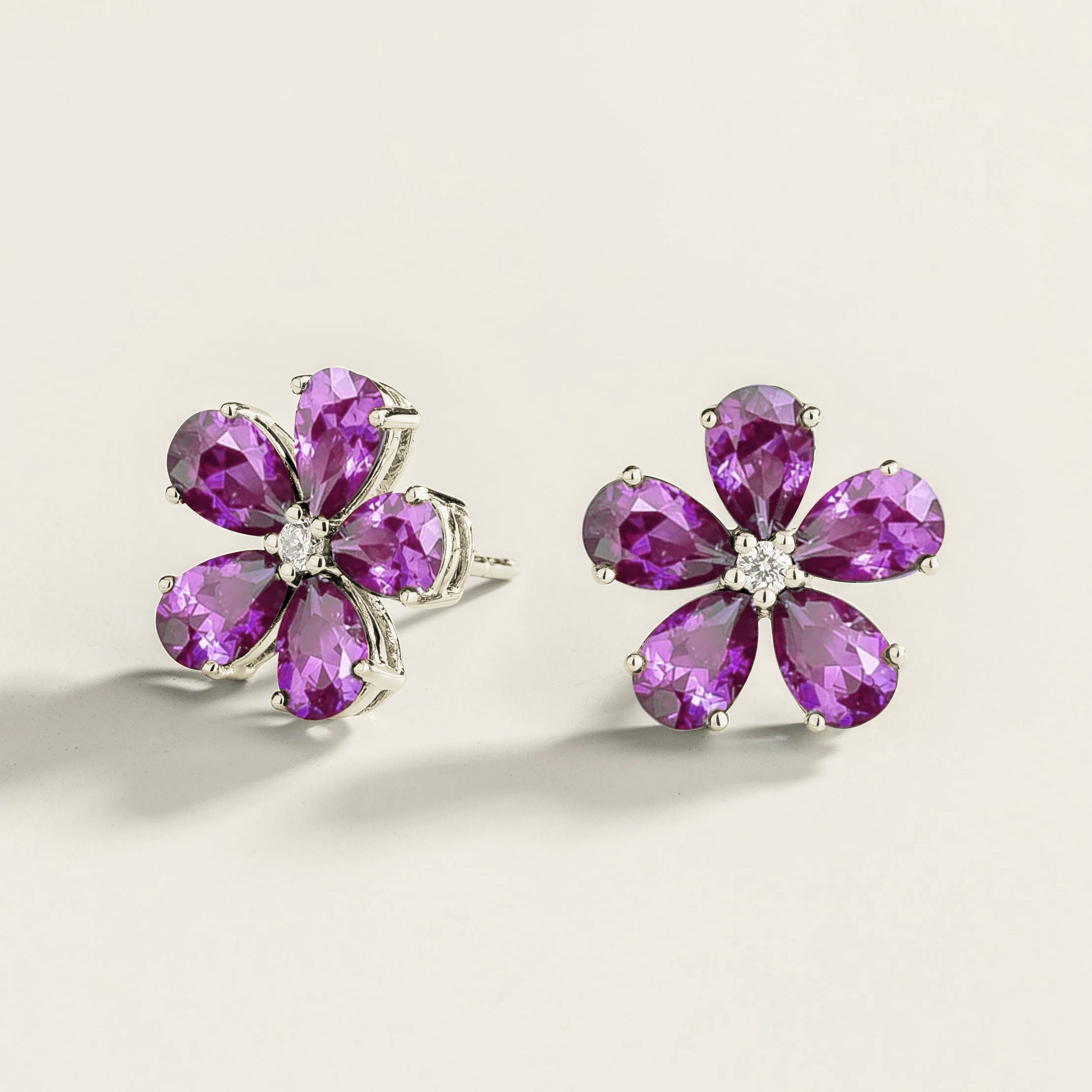 Florea 5 petals flower earrings in white gold set with Purple Sapphires and Diamonds.