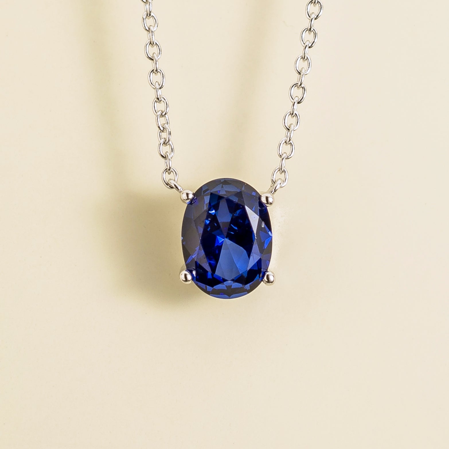 Ovo Blue Sapphire Oval Solitaire Pendant Necklace in White Gold