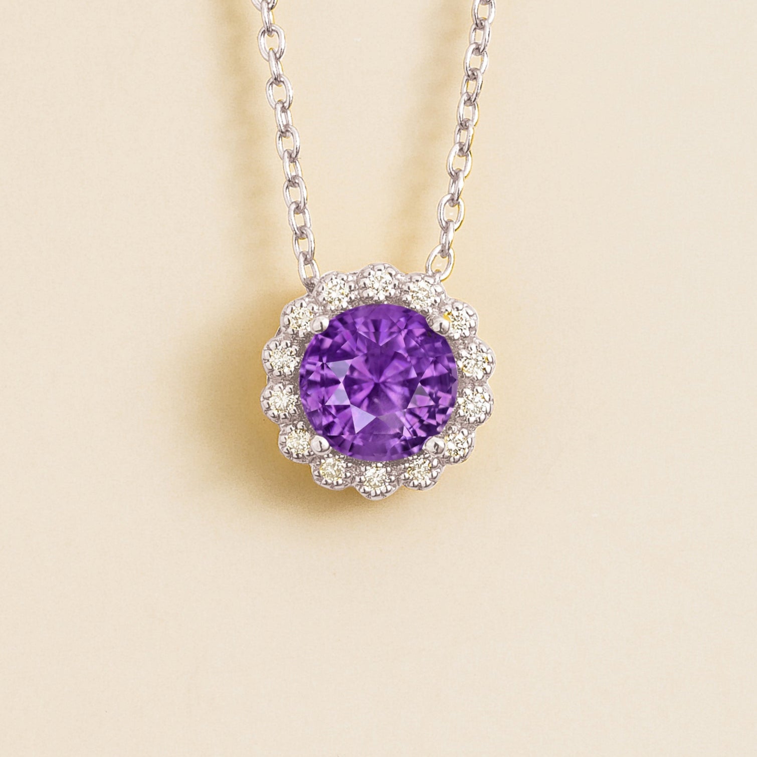 Solen white gold necklace set in purple sapphire and diamonds.