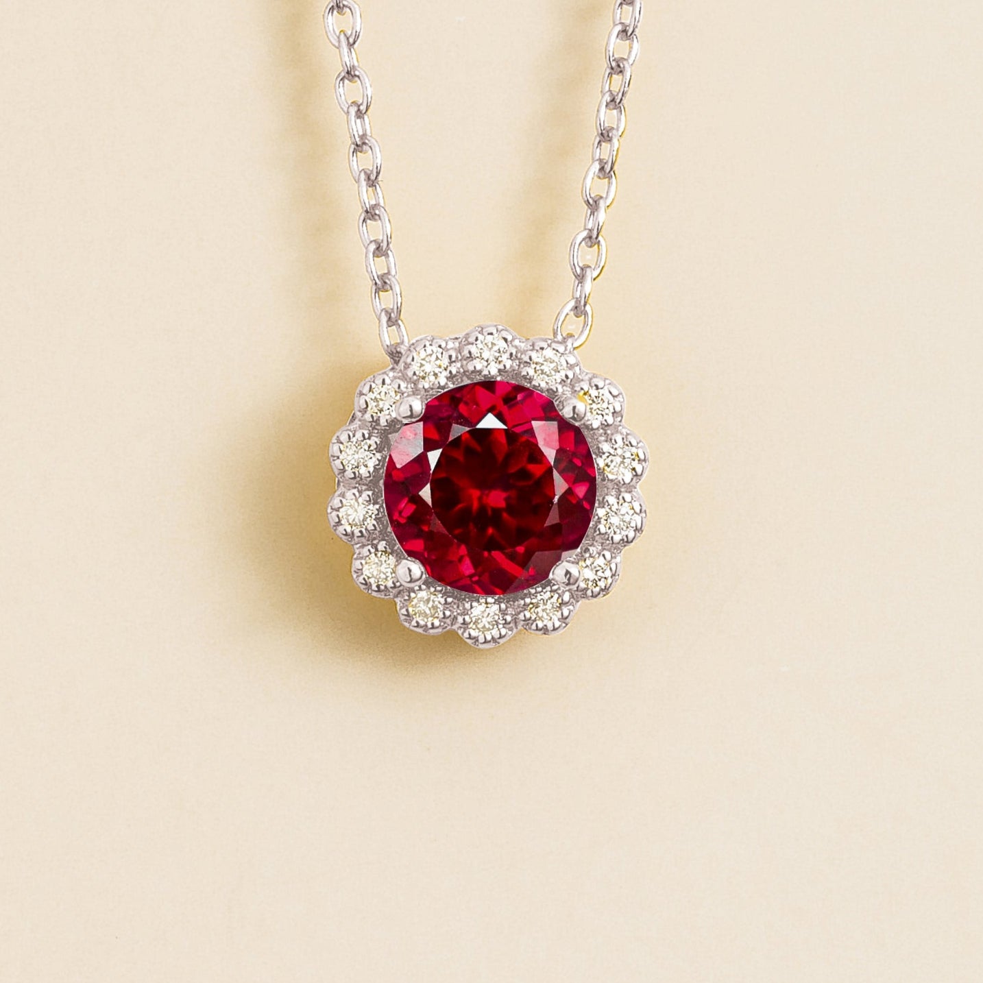 Solen white gold necklace from Juvetti set with ruby and diamonds.