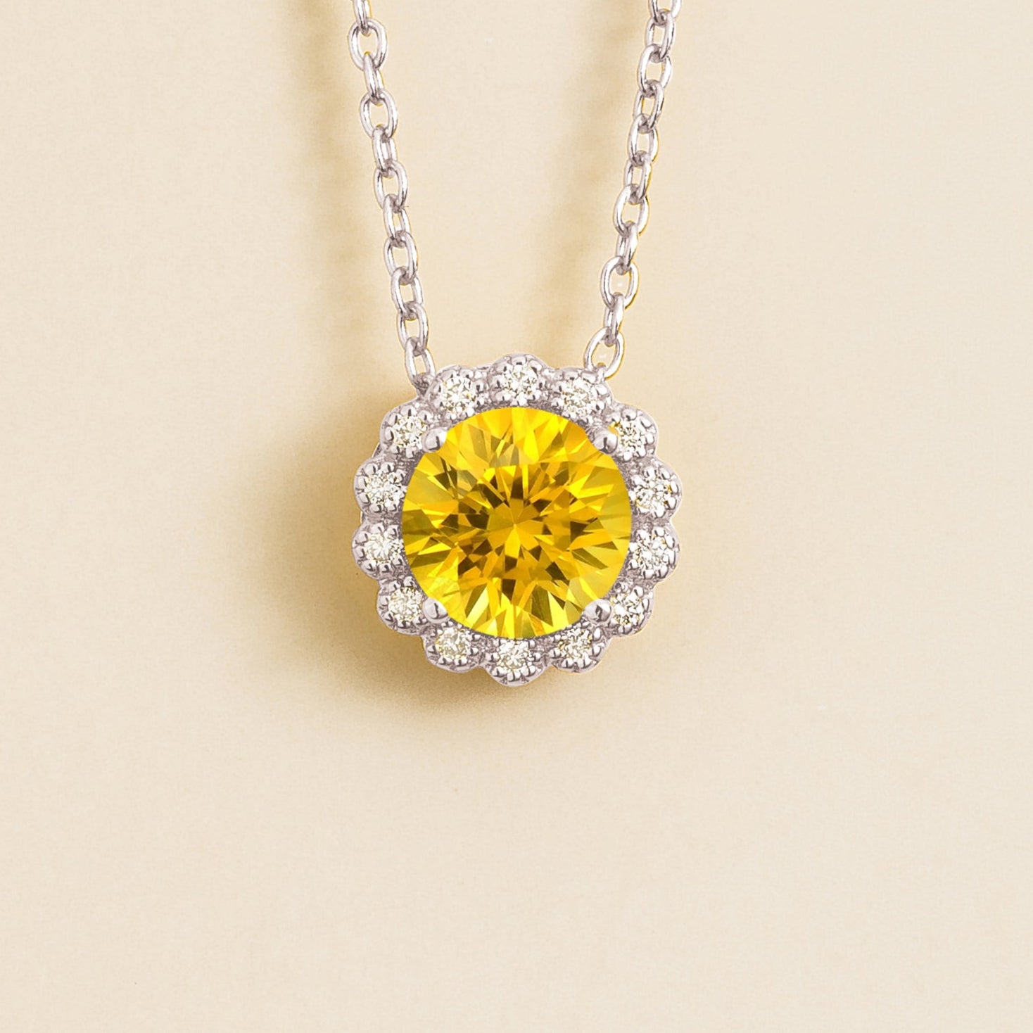 Solen white gold necklace from Juvetti set in yellow sapphire and diamond.