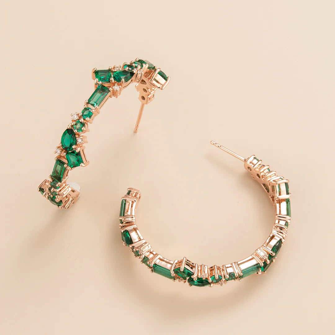 Lanna large hoop earrings in 18 kt pink gold vermeil set with lab grown Emerald and Diamond gem stones.