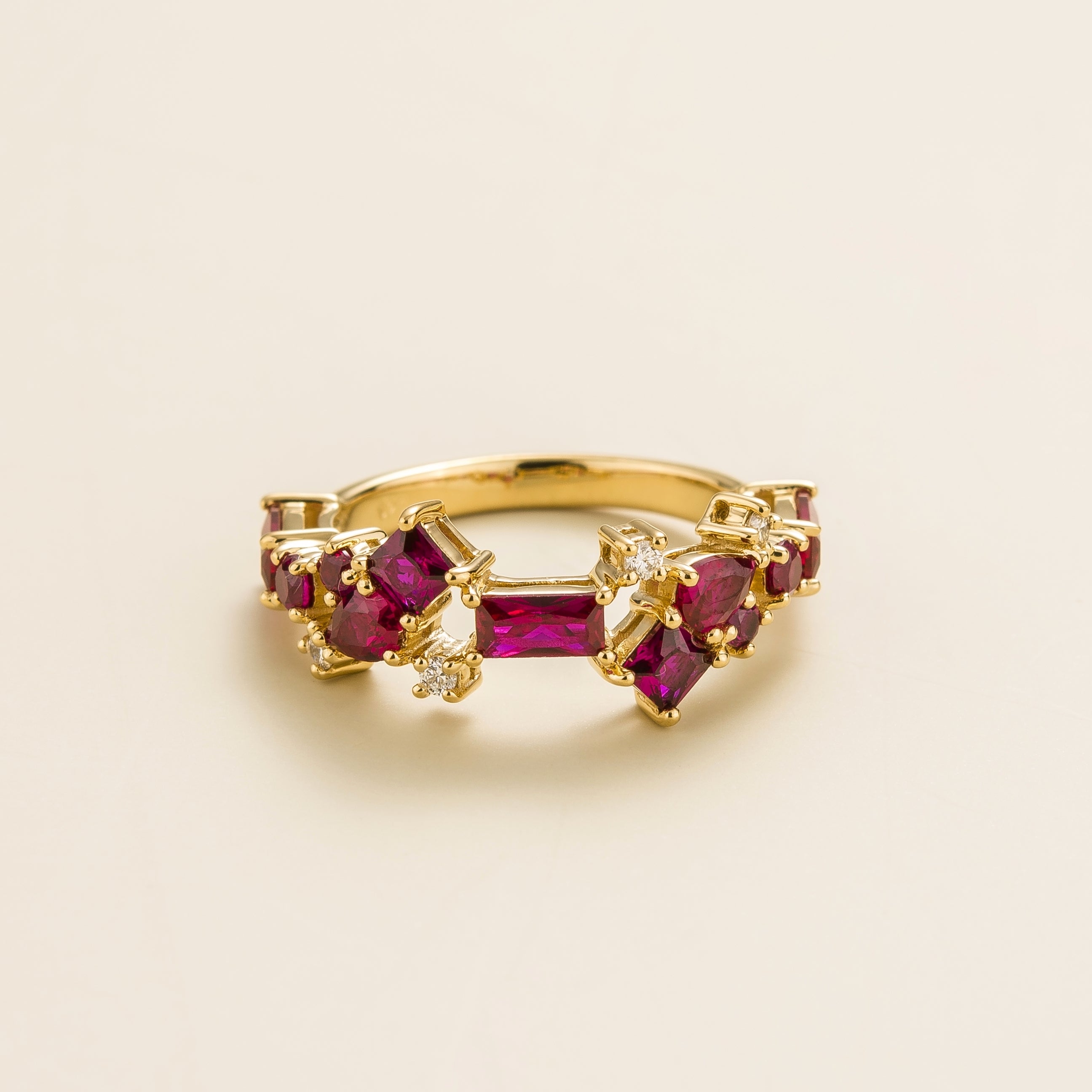 Juvetti yellow gold ring featuring lab-grown rubies in mixed cuts with delicate lab-grown diamond accents.