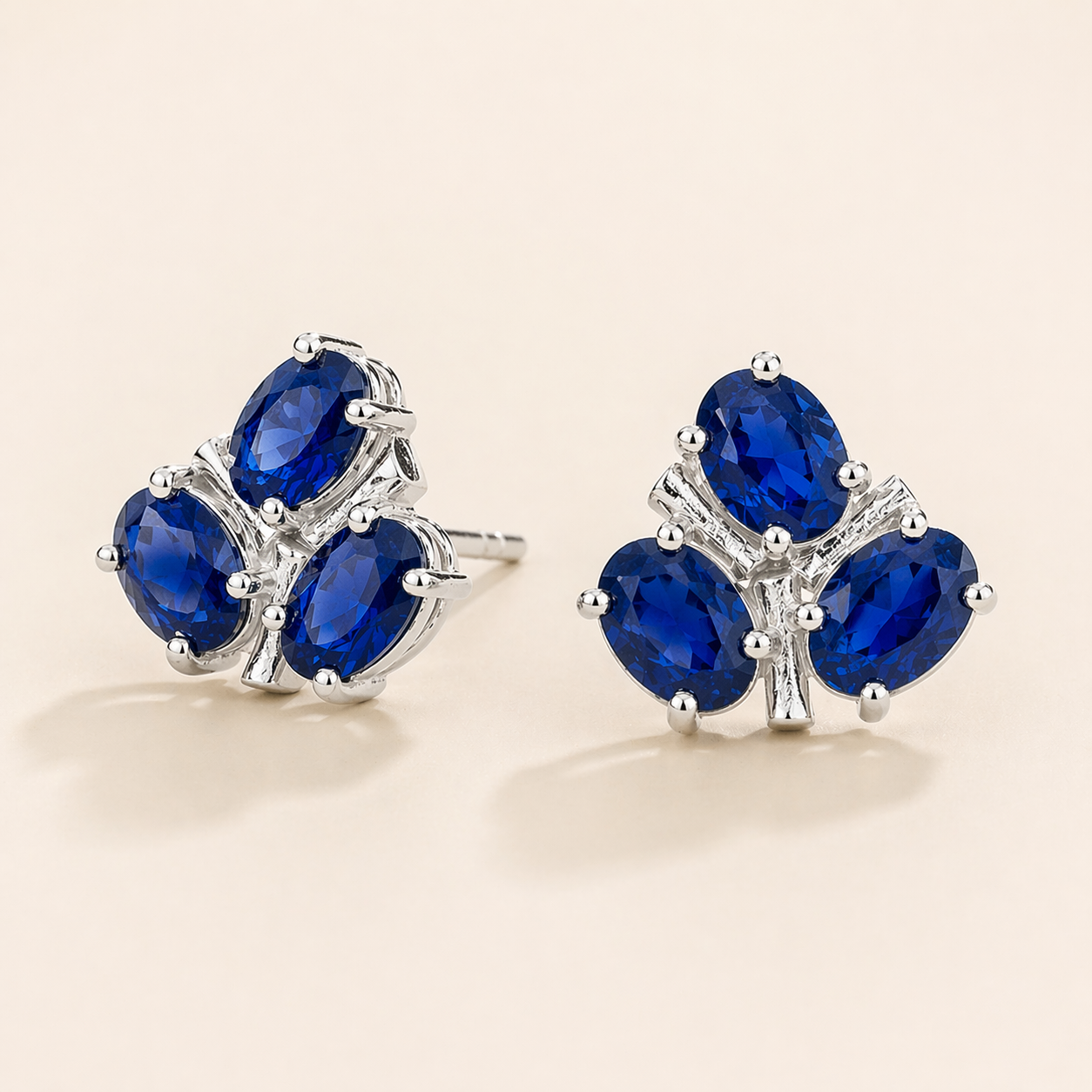 Ligna Oval Blue Sapphire Cluster Stud Earrings in White Gold