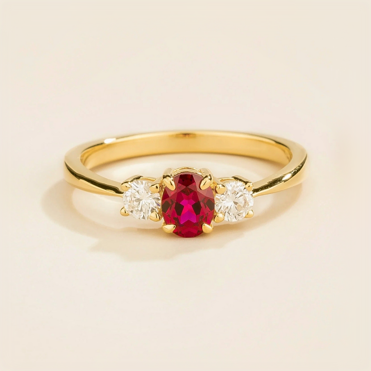 3 gemstones gold ring featuring a central ruby flanked by two diamonds Juvetti London