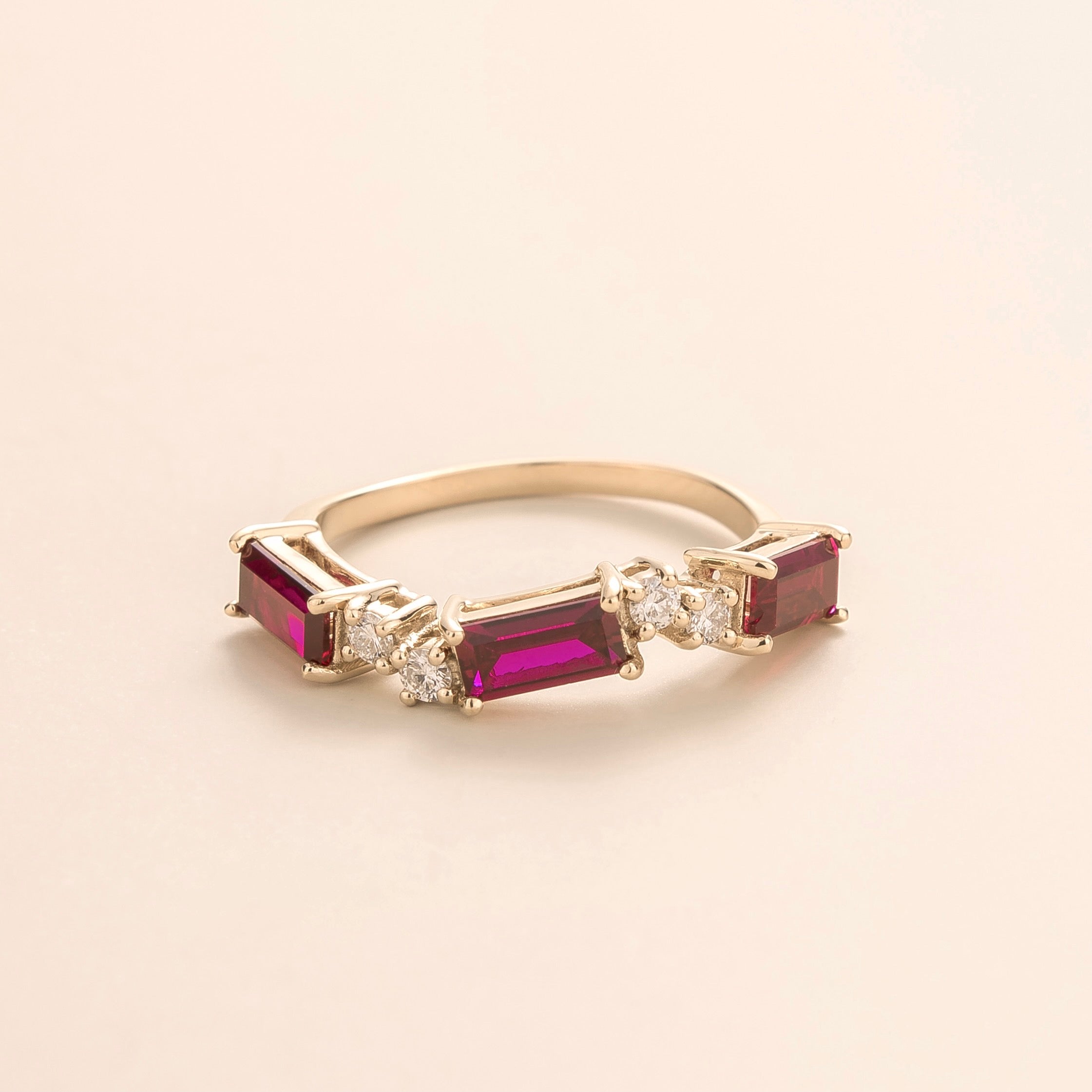 Juvetti white gold ring showcasing ethical lab-grown baguette-cut ruby and round brilliant diamonds.