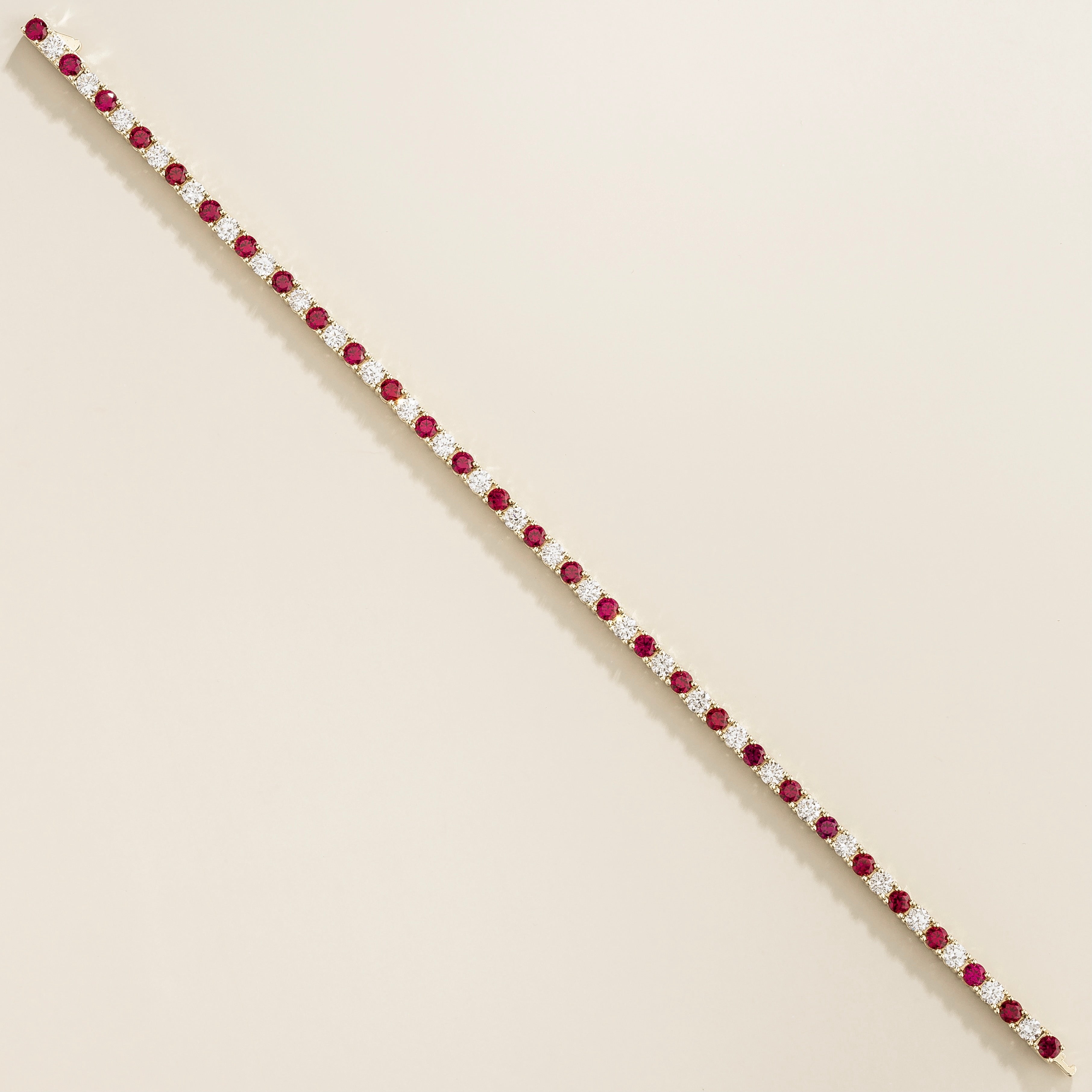 luxury tennis bracelet in white gold set with ruby and lab grown diamond stones