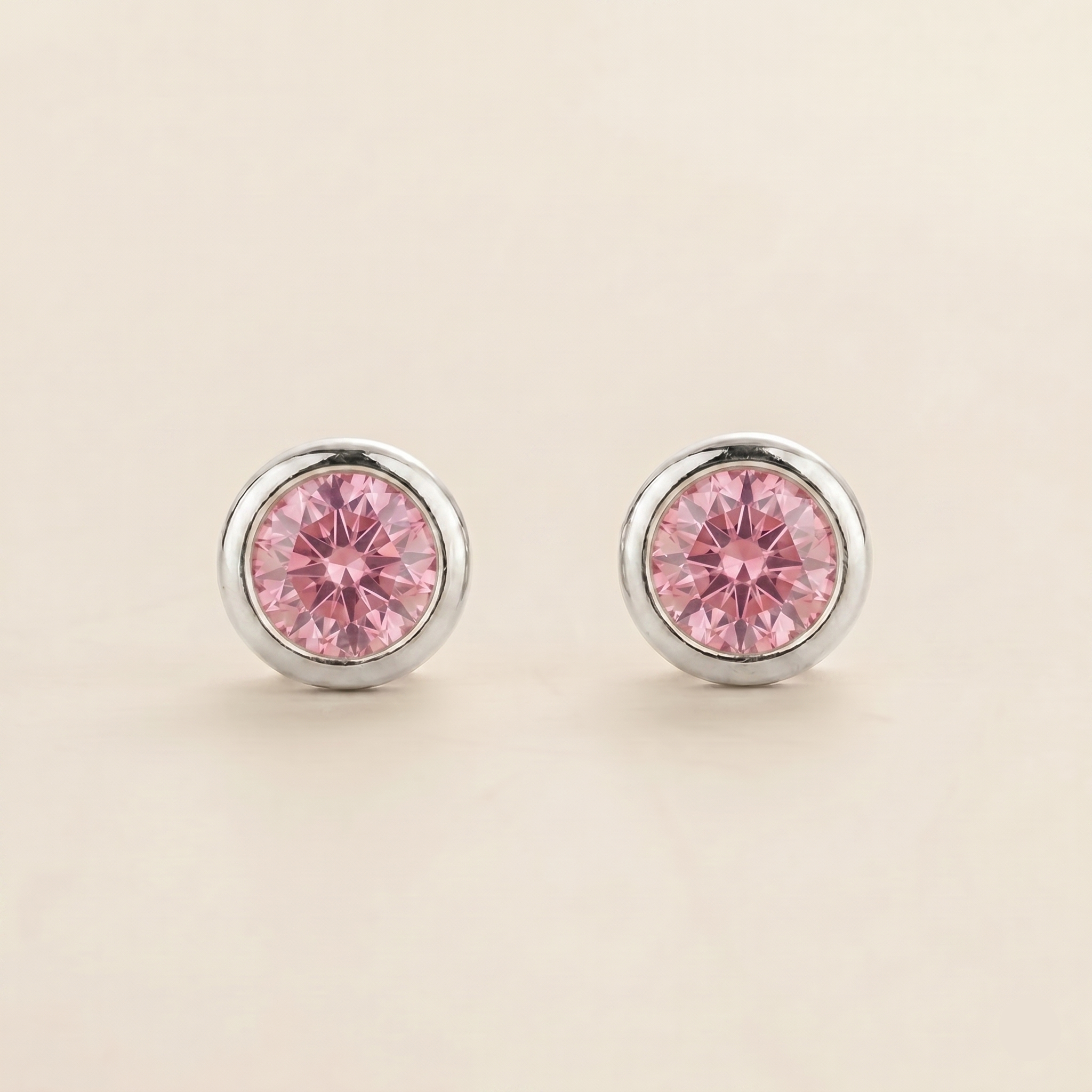Round lab-grown pink sapphire bezel-set Margo earrings in white gold | Juvetti London