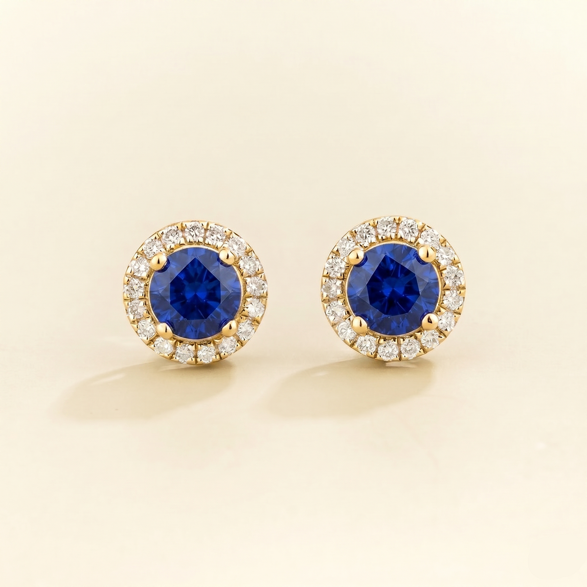 Round lab-grown blue sapphire and diamond halo Mars earrings in gold | Juvetti London