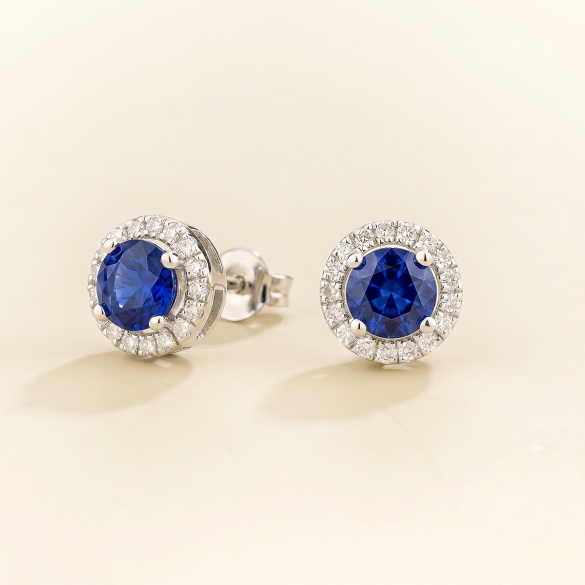 Mars Blue Sapphire Round & Diamond Halo Earrings In White Gold