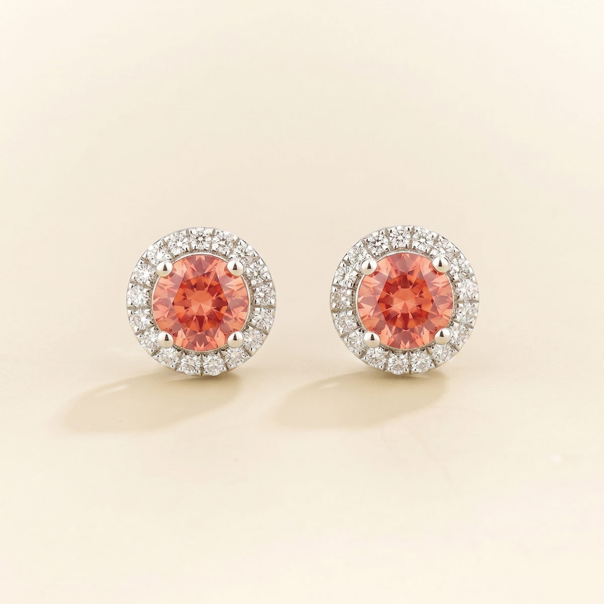 Round lab-grown padparadscha sapphire and diamond halo Mars earrings in white gold | Juvetti London