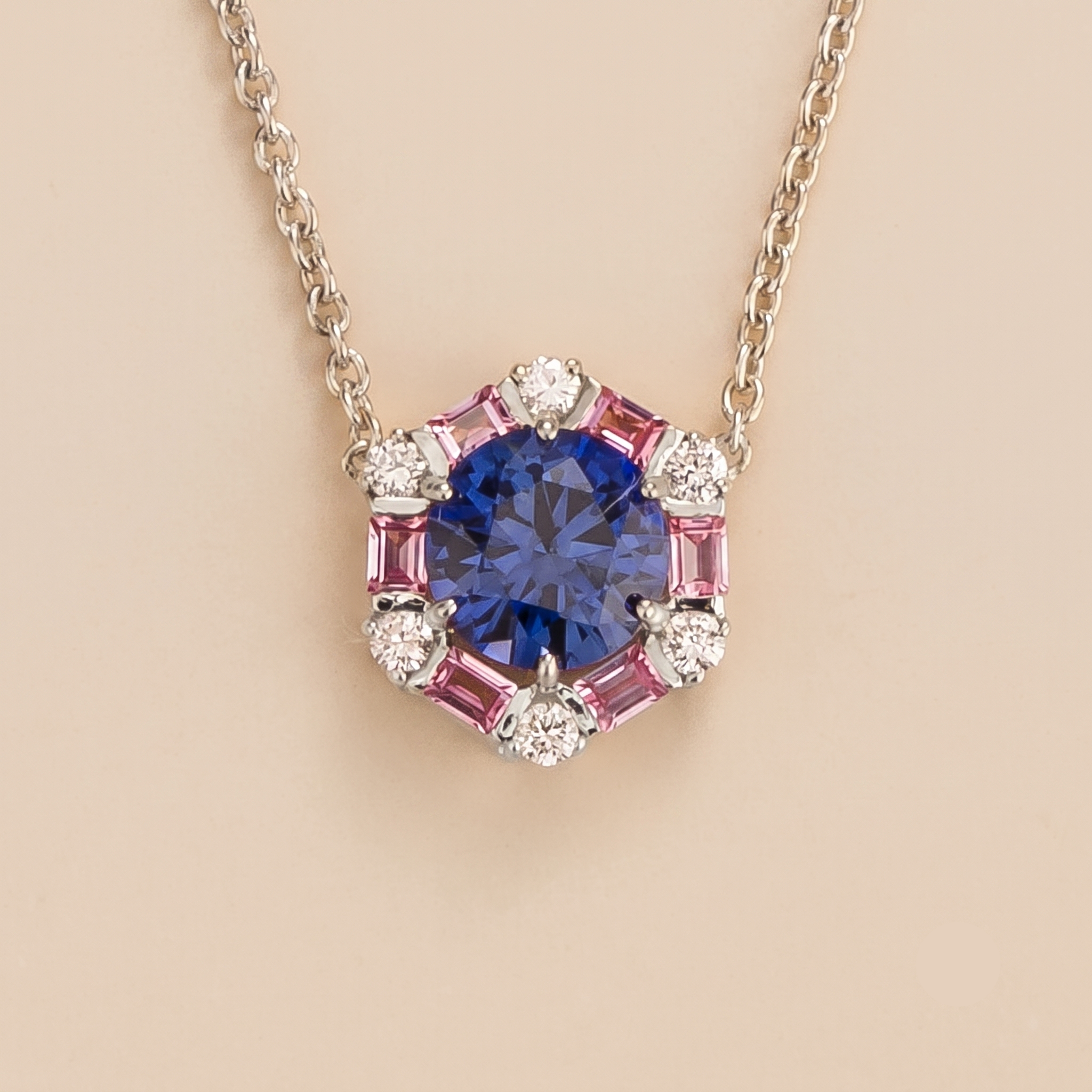 Hexagon halo lab-grown blue sapphire, pink sapphire and diamond pendant necklace, Melba design in white gold | Juvetti London
