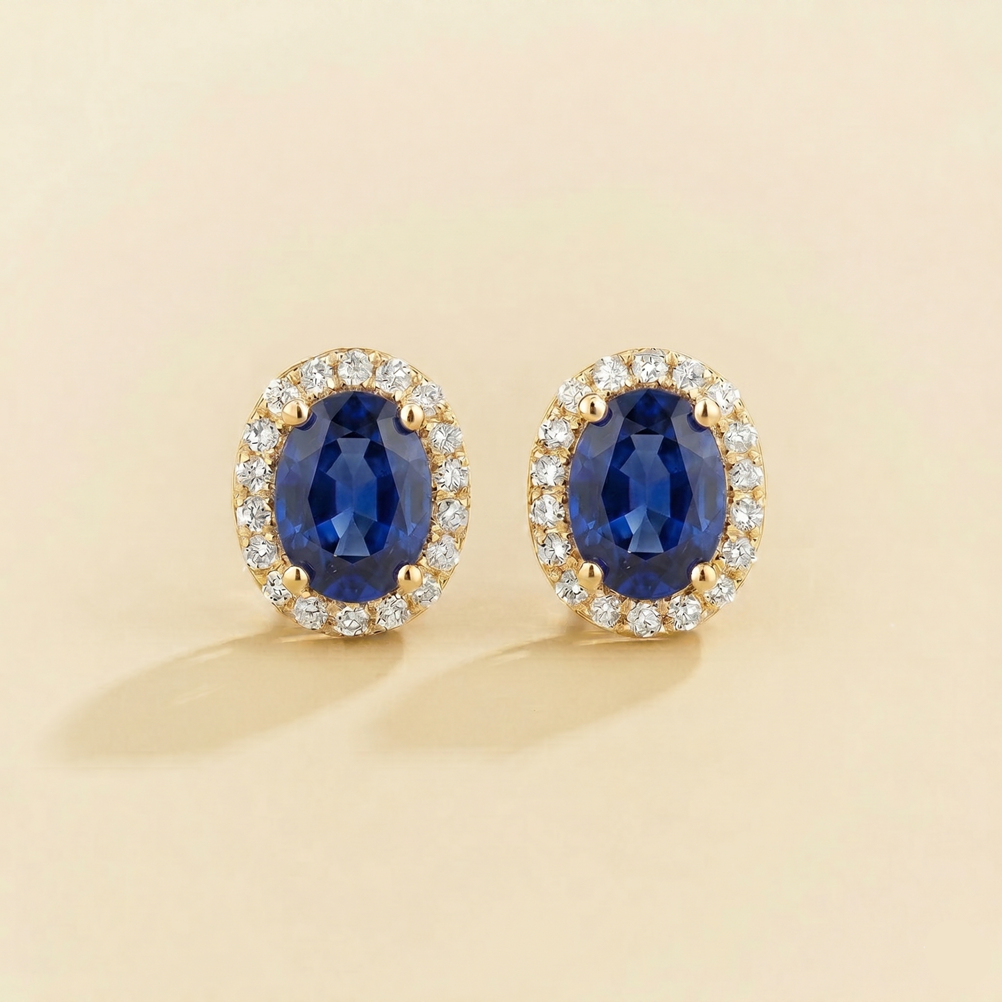 Oval lab-grown blue sapphire and diamond halo Mina earrings in gold | Juvetti London