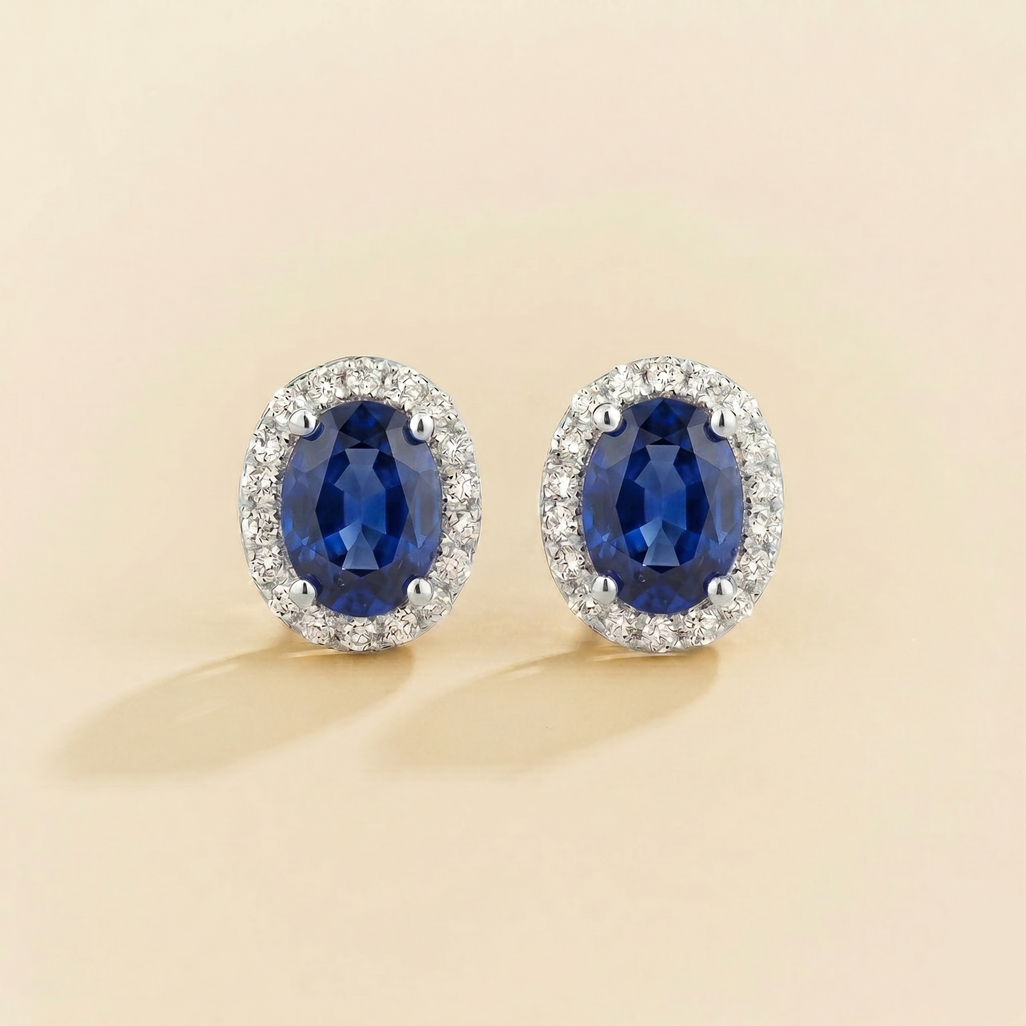 Oval lab-grown blue sapphire and diamond halo Mina earrings in white gold | Juvetti London