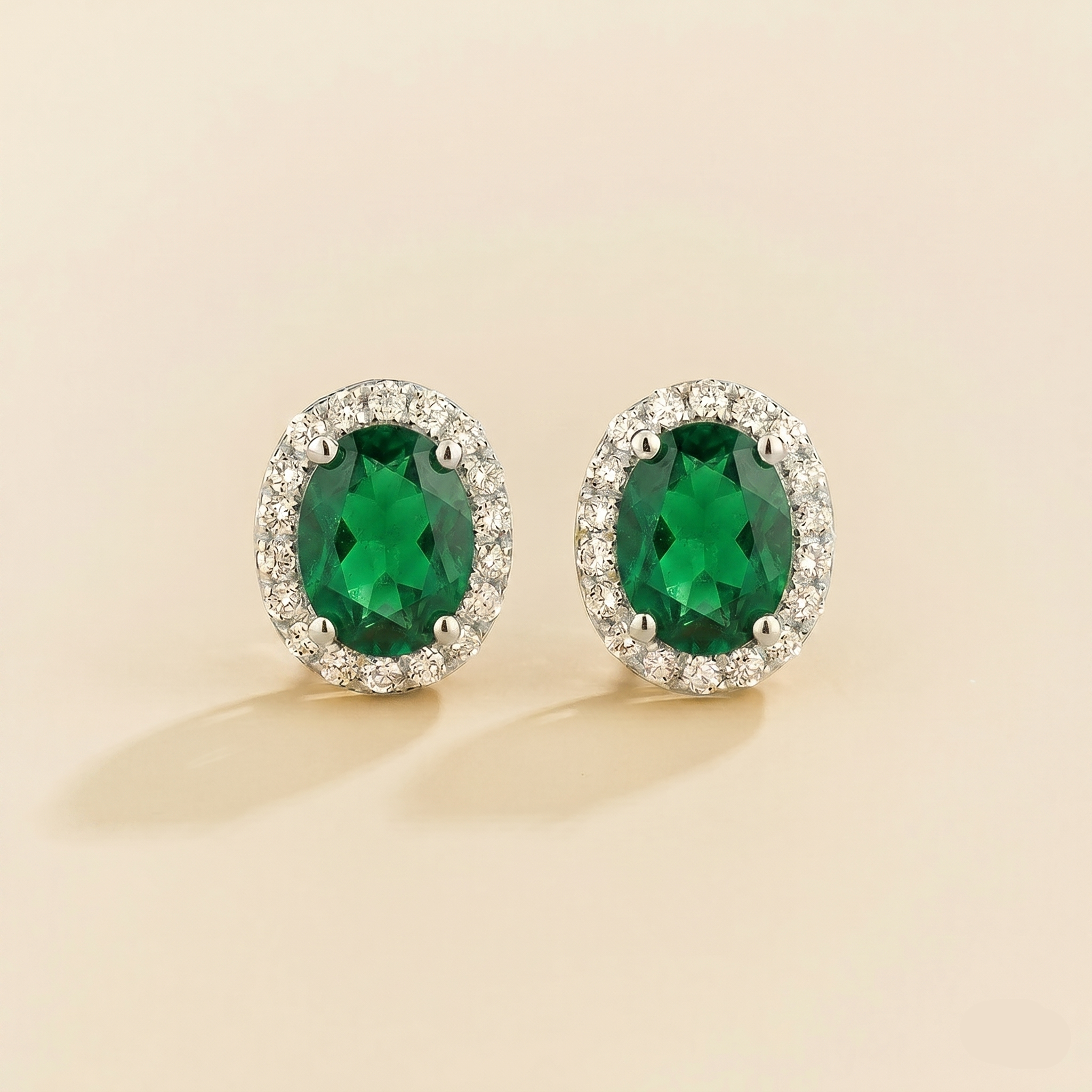 Oval lab-grown emerald and diamond halo Mina earrings in white gold | Juvetti London